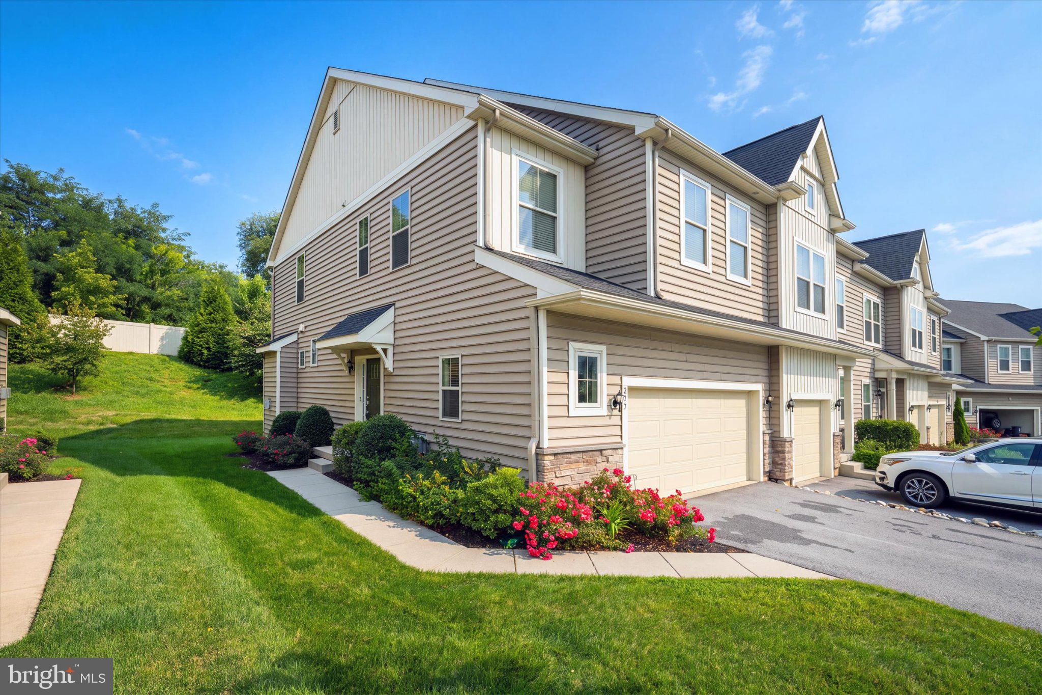 Discover the charm of this beautifully maintained end-of-row townhouse in the desirable Pemberton community. Built in 2021 and barely lived in, this home boasts a total spacious 2,385 sq. ft. Situated at the end of the street, just off of the cul-de-sac positions this home in a desirable and quiet neighborhood location. Entering the home welcomes you to the bright and open floor plan. The kitchen is a chef's delight, equipped with upgraded stainless steel appliances, a built-in microwave, and a generous island that invites culinary creativity. The glass sliders take you to a private deck to enjoy morning coffee on warm days or remain inside in front of the cozy gas fireplace in the living area on cooler evenings. Retreat upstairs to the serene primary en-suite, complete with customized walk-in closets, designed with elegant built ins and abundant, well-organized storage. A luxurious bathroom features both a walk-in shower and a soaking tub. Two additional bedrooms provide ample space for guests or a home office.  The customized plantation shutters throughout the first level offer excellent light control and blinds throughout the upper level ensure privacy. The fully finished lower level offers additional living space, 2 egress windows for maximum natural light and an additional bonus of a half bath. Ideal for a family room, playroom, home office or media center. With convenient upper-floor laundry, your daily routines are made easier. The Pemberton community enhances your lifestyle with amenities such as jogging paths and a tot lots/playground, fostering a sense of connection among neighbors. Local parks and schools are just a stone's throw away, providing recreational opportunities and educational resources. The association takes care of lawn maintenance and snow removal, allowing you to enjoy your home without the hassle of upkeep. With an attached garage and ample driveway parking, convenience is at your fingertips. Home is close to shopping, restaurants and downtown Kennett Square. This home is not just a place to live; it's a place to thrive. Experience the warmth and comfort of Pemberton living today!