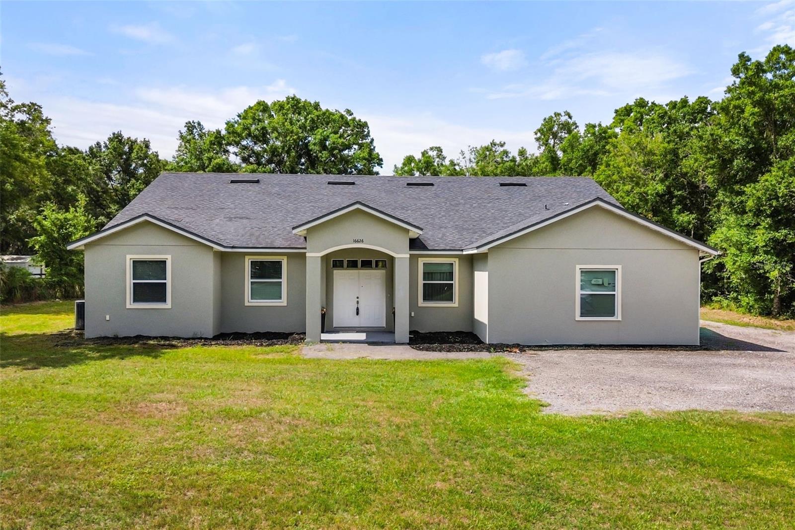 SELLER FINANCE AVAILABLE!!! This property isn’t just a home—it’s a canvas for your lifestyle and vision. Zoned A-2 Farmland Rural, it offers flexibility and open space that most city lots can’t provide.ENDLESS POSSIBILITIES... Add a guest house, tiny home, or another in-law suite. Raise chickens, goats, or horses. Plant fruit trees or grow your own garden. Create walking trails, ATV paths, or even a koi pond or fishing spot.INCOME & LIFESTYLE OPTIONS... Build a barn or workshop, add RV or boat storage, or explore agri-tourism ideas like a pumpkin patch, sunflower field, or “pick-your-own” orchard. Host events, create an artist studio, or design a private retreat with outdoor living spaces.With its generous zoning and extra land, this property gives you the freedom to design the lifestyle you want—whether that’s generating income, enjoying the outdoors, or simply creating your own private escape. Don’t just buy a home, buy a lifestyle with possibilities.Yes, you read that right—your new home sits on 2.36 acres with NO HOA! This spacious 5BR/3BA property offers privacy, flexibility, and location. The main home features 3BR/2BA, a large entryway, family room, dining space, and a split floor plan with private master suite. The attached in-law suite has its own entrance, 2BR/1BA, plus kitchen and living area, perfect for guests or multigenerational living. If preferred, the home can easily remain a full 5BR/3BA residence without being used as a separate in-law area.Outside, enjoy endless opportunities on the land: add a guest house, barn, workshop, garden, or stables, raise animals, host events, or create a private retreat. All this while being just minutes from Waterford Lakes shopping and dining—yet tucked away enough for a true country feel in the city.