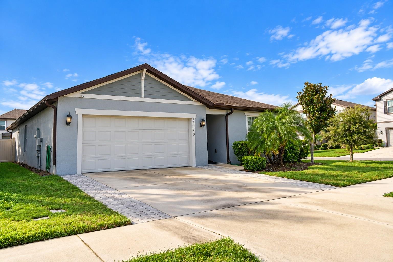Welcome to this beautiful 4-bedroom, 2-bathroom home in the gated, resort-style community of Wesbridge in Wesley Chapel! Built in 2020, this single-story residence features 1,850 square feet of comfortable living space, thoughtful upgrades, and a convenient location.Step inside to discover updated flooring, a beautiful wood accent wall, and inviting living spaces designed for everyday comfort and entertaining. The kitchen opens to the main living area, creating a welcoming atmosphere for gatherings and relaxation.Enjoy Florida living in your own backyard, featuring added pavers, a screened patio, and PVC fencing, creating a wonderful outdoor space for relaxing and entertaining.Experience the resort-style amenities of Wesbridge, including a community swimming pool with cabanas, splash pad, playground, dog park, and clubhouse.LOCATION IS A HIGHLIGHT! Conveniently situated near Wesley Chapel Elementary School, Thomas E. Weightman Middle School, and Wesley Chapel High School, with easy access to Wesley Chapel District Park, shopping, restaurants, Tampa Premium Outlets, The Shops at Wiregrass, I-75, and SR-54.Enjoy the combination of modern comfort, community amenities, and a desirable Wesley Chapel location.Priced at $369,900! Schedule your private showing today and discover everything this home and the Wesbridge community have to enjoy!