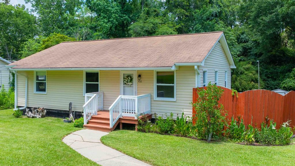 This charming home offers a 3BR/1.5BA main level with hardwood floors, a spacious kitchen, and a large deck overlooking a private, fenced backyard. Downstairs features two oversized studio-style bedrooms, a shared kitchen and bath, laundry, and a bonus room—perfect for extended family or rental income. No carpet (hardwood/tile throughout), mature fig and loquat trees, and a quiet, established neighborhood just minutes from schools, parks, and downtown. Live, rent, or both—this one checks all the boxes!