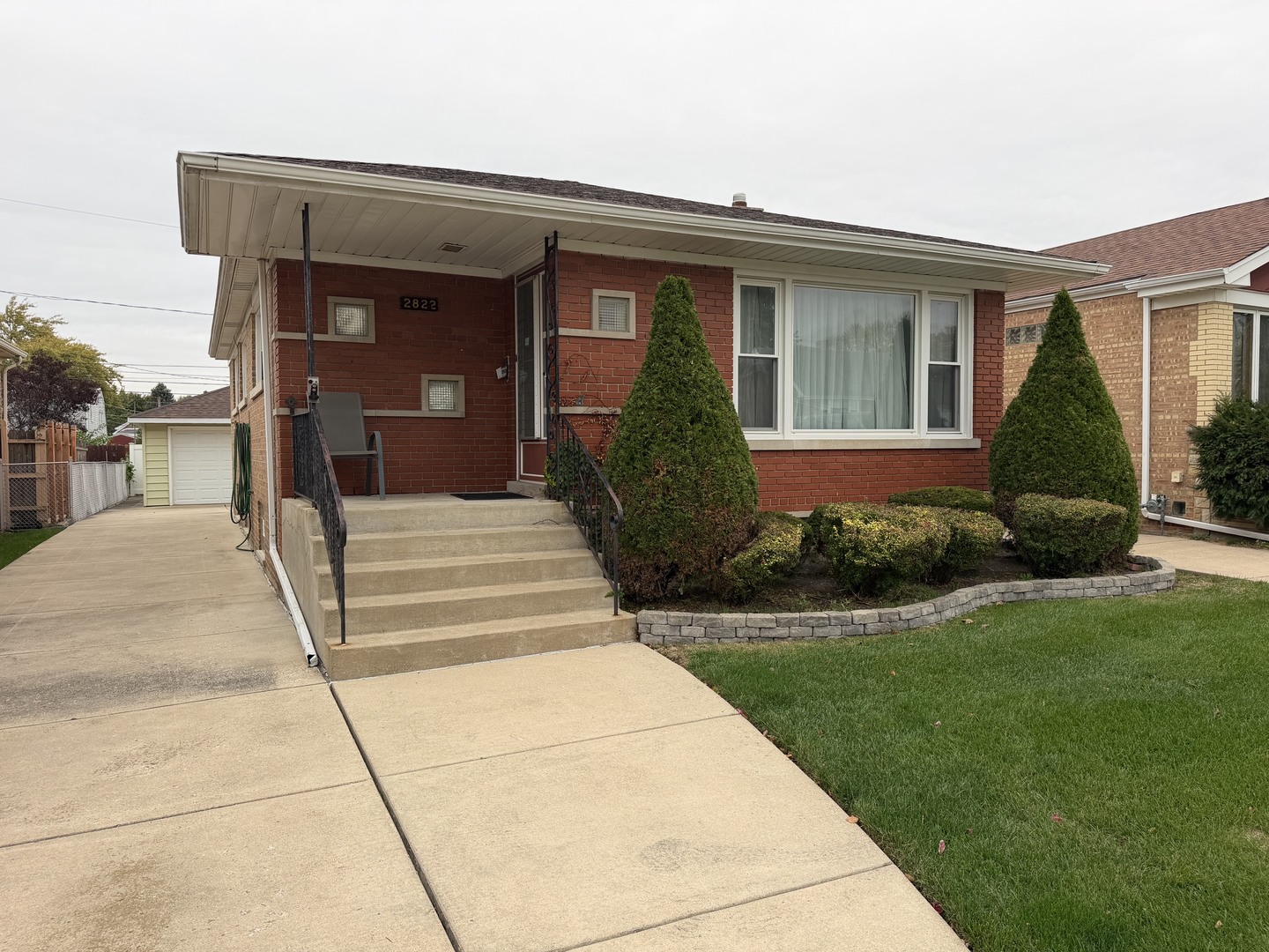 Quality-Built Face Brick Raised Ranch with a Huge Basement! This well-maintained home features aluminum gutters and soffits, vinyl replacement clean from one side windows, gleaming hardwood floors, and an updated full ceramic bath. The spacious basement offers plenty of room for storage, hobbies, or additional living space, with vented glass block windows. Forced-air heat and central air conditioning provide year-round comfort. The furnace, central air conditioning, and roof all appear to be newer. Outside, enjoy a beautifully manicured lot and a 1 1/2-car detached garage with an automatic door opener. Priced to Sell! This is an estate sale, and the property must be sold AS-IS.  Don't miss this great opportunity!