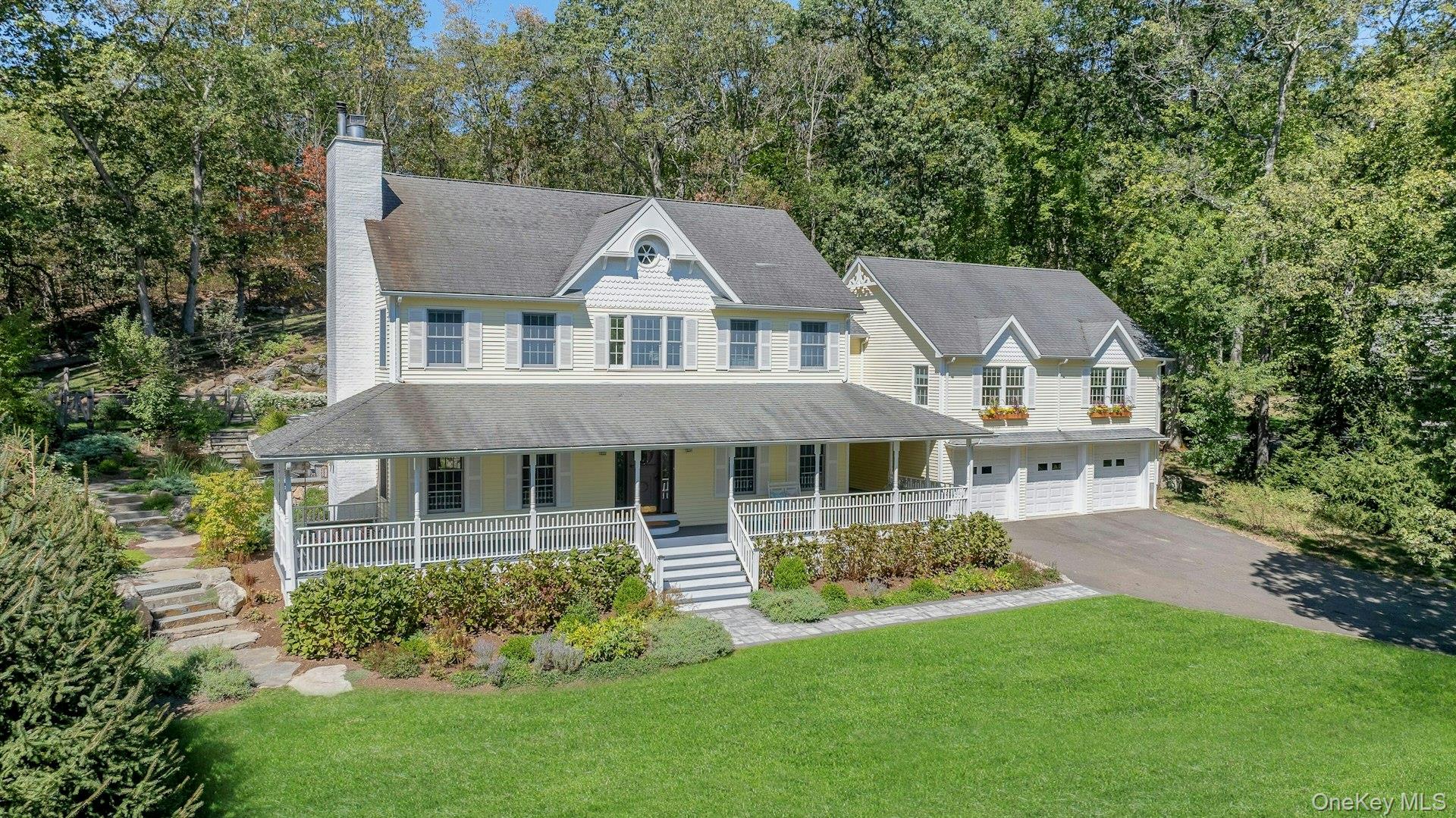 New  to the market! This four bedroom, Colonial Farmhouse with a rocking chair porch features  a classic layout of rooms. There is  a private and quiet, newly built in-ground pool with a large  built-in shelf for sunbathing/ kids/ pets and an electric cover.  The pool is dramatically sited among large natural rocks.  Vintage wide board flooring reclaimed from an antique Virginia barn is incorporated throughout the home and there is exceptional light in all the rooms due to glass French doors, over-sized windows and skylights. The  primary suite  has high ceilings, a walk-in closet and  a generously sized Carrera marble bath.  Includes a newly renovated guest suite/pool entertaining room with access to the pool and terraces. Beautiful landscaping, a 3 car garage and ample lower level  storage add to this terrific property.