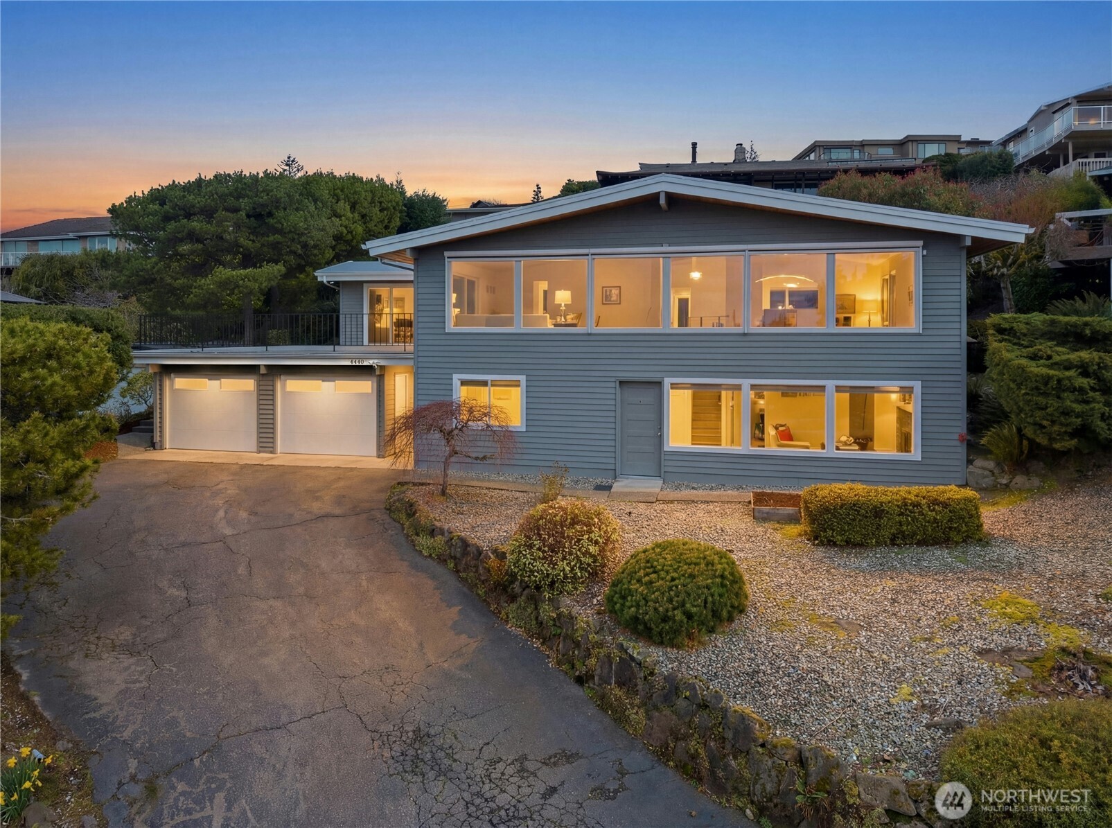 Welcome home to this meticulously maintained and remodeled mid-century Somerset home with breathtaking views and stunning sunsets. Unassuming street presence gives way to a private sanctuary with 270 degree views captured throughout. Open great room features vaulted ceiling, Acacia engineered hardwood floors, sleek modern cable railing, designer light fixtures and floor to ceiling windows. Open kitchen boasts crisp white cabinets, quartz counters, large island, LG/Bosch stainless steel appliances, and on-demand hot and cold filtered water. Oversized Primary Suite with organized closet systems and ensuite bath features double sinks, TOTO brand washlet bidet, heated towel warmer and floors. Huge entertaining deck over the garage is perched above the street and trees to capture and savor the ever-changing views. Lower level features separate entry, 1 full bedroom 3/4 bathroom, family room and plenty of storage and a work shop. Heat pump (A/C) and automatic exterior shades keep you cool in the summer. Have peace of mind and completely turn-key with a new roof, windows and doors in 2019, sewer liner installed in 2014, main water line in 2018, new garage door in 2022, new tankless water heater in 2025, electrical, plumbing and exterior paint.