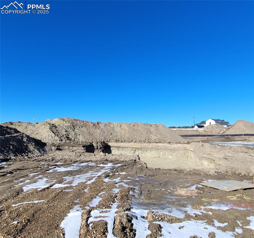 Welcome Home to the Falkirk, ranch plan, in a Colorado elevation with a 3 car garage! Relax in the Great room with engineered wood flooring, floor outlet, ceiling fan, LED lighting, and a cozy gas fireplace! The Kitchen with quartz countertops, pantry, large island providing additional seating, and stainless steel gas range, pyramid hood, drawer microwave, and dishwasher. Primary suite is accompanied with a plush 5-piece bathroom with separate vanities, free standing tub, and shower with bench and tile surround. A second bedroom, full bathroom, and laundry room complete the main level. Finished lower-level with 9' ceilings boasts a spacious family room prepped for a future wet bar. Two bedrooms, one with a walk-in closet, and a full bathroom complete the lower-level living. An oversized storage room and utility area with a tankless water heater, 96% energy efficient furnace with a variable speed motor, sealed ducts, pex plumbing, sprinkler stub, and an active radon mitigation in this energy rated home. Located in the Desirable Highline at Wolf Ranch Community!
