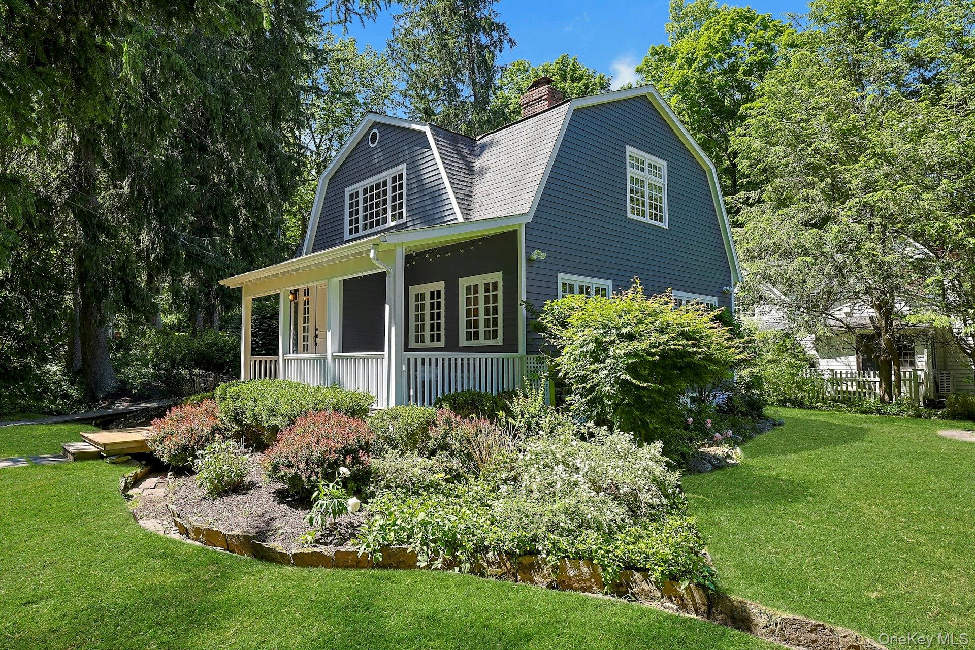 The truly enchanting waterfront setting of this exceptional in-town 1930 Dutch Colonial is defined by sweeping views, lush landscaping, expansive flat yards and a pristine spring-fed duck pond. Meandering stone pathways guide you through beautifully curated grounds, revealing peaceful gathering spaces and quiet corners perfect for enjoying the storybook scenery. Just off the kitchen, a generous stone patio creates an ideal backdrop for seamless indoor-outdoor entertaining; the front porch is a classic for your rocking chairs and morning coffee.The home blends timeless craftsmanship with modern comfort, featuring a stunning gourmet kitchen, elegant French doors, central air and so much more, thoughtfully designed for effortless everyday living.Perfectly positioned in the heart of the village of Chappaqua, with no need for a car to get to everything, you’re just moments from town, shops, restaurants, and the Metro-North train station, approximately 45 minutes express train to New York City. Located in one of Westchester’s most sought-after communities, Chappaqua is known for its fabulous schools, charming downtown, scenic wooded landscapes, and outstanding quality of life. Taxes with STAR approximately $20,556. A magical home in a setting like this is a rare find, and the ability to enjoy this spectacular quality of life within steps to farmers market, gourmet food shops and restaurants, stores, train and everything you need is a dream come true.