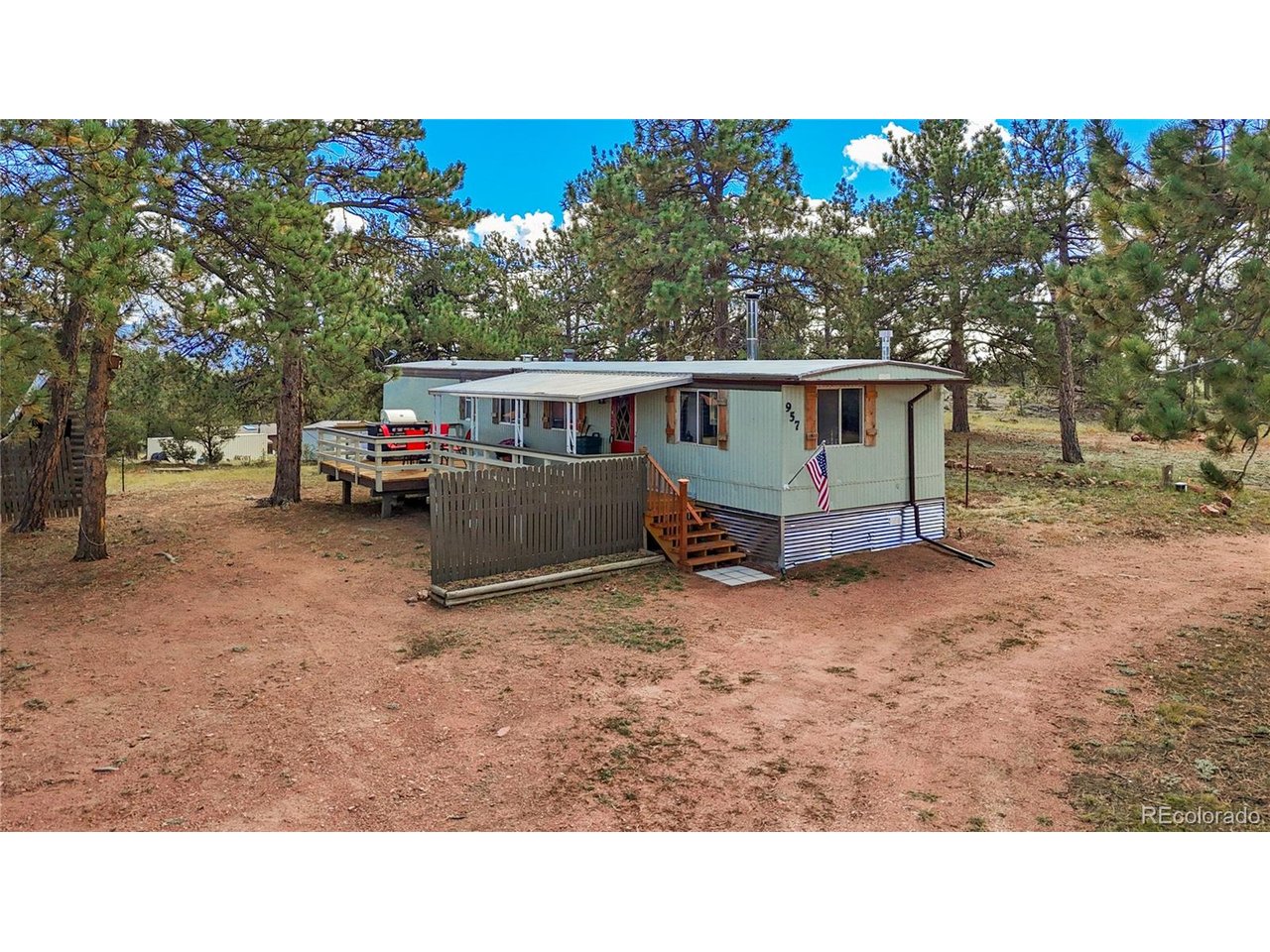 Your Colorado mountain getaway is ready and waiting! Set on 2 wooded acres in Florissant, this newly remodeled and turn-key furnished home combines rustic mountain character with the flexibility to serve as a full-time residence, weekend escape, hunting basecamp, or vacation property. With beautiful views toward Pikes Peak and Mt. Pisgah, towering pines, and plenty of usable outdoor space, this property makes it easy to enjoy everything Colorado has to offer.Inside, the 2-bedroom, 1-bath home is warm and inviting with exposed wood beams, wood-paneled ceilings, abundant natural light, and a wood-burning stove anchoring the living room. The updated kitchen features stainless steel appliances, a deep dual-basin sink, ample storage, and an island, while the remodeled bathroom offers a clean, modern feel. Offered furnished, the home is ready to enjoy from day one.Outside, relax or entertain on the spacious deck while taking in the peaceful mountain setting. Five outbuildings provide plenty of storage and functional space, including four smaller sheds and a larger workshop with covered carport areas. There's also room for RV parking, multiple vehicles, outdoor equipment, and all the toys that come with a Colorado lifestyle. With no HOA and both short- and long-term rentals permitted, there is plenty of flexibility for future owners.Use it as your home base for year-round adventure-head toward Breckenridge or Monarch for skiing, enjoy gaming and entertainment in Cripple Creek, or take advantage of the area's hunting and outdoor recreation. Then come home, fire up the wood stove, and settle into your own quiet piece of the Colorado mountains.Whether you're searching for a primary residence or mountain retreat, this Florissant property offers a unique combination of privacy, storage, views, and access to the Colorado lifestyle.