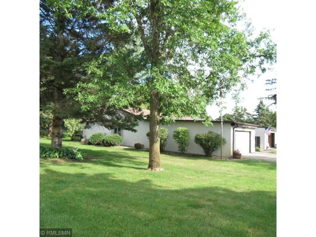 It is a rare opportunity to find a corner unit in this Association. This well-cared for two-bedroom patio home offers an open concept, 2 bedrooms- Primary with step in shower and walk-in closet. Additional full bath off second bedroom. Pantry area with combined laundry area. Private patio off living room with mature trees in back yard. Double attached garage, Stucco exterior with partially brick front. Roofs, Exterior paint, Driveways have all replaced or updated in last four years. This is a 55 and older community only- NO exceptions! Pet friendly, sixteen home-owner units and city amenities with a taste of the country- located on over 4 acres covered mostly in pine and  woods  nearby where wildlife is prevalent.