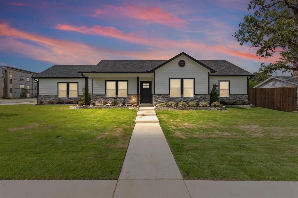 NEW construction just built in 2025! You can watch your children walk to school from this corner lot home with crosswalk and newly installed sidewalks. This handsome 3bed, 2bath home comes with elegant upgrades. In the u-shaped kitchen, you'll find granite countertops, farm sink, subway tile backsplash, and shaker cabinets with plenty of countertop space and storage. Rich luxury vinyl plank floors enhance the living and dining areas, hall, and bathrooms. Ceiling fans, in the living room and in each bedroom, will help you stay cool while recessed lights brighten every room. The primary bedroom with raised ceiling includes an ensuite bathroom with granite countertops, double sink, and oversized walk-in shower with seat. Two additional guest bedrooms share a full bathroom in the hall that comes with granite countertops and bath with sleek glass doors. A two-car side entry garage provides a place to shelter your cars from the weather. Sit on the covered back patio, soaking in the backyard with its privacy wood-fencing and lush green space. Keep this property's curb appeal with a fully sodded grass lawn, built-in automatic sprinklers, landscaping, and porch. Easy interstate access makes it great for commuters. Buyers looking for peace of mind will appreciate this new construction!