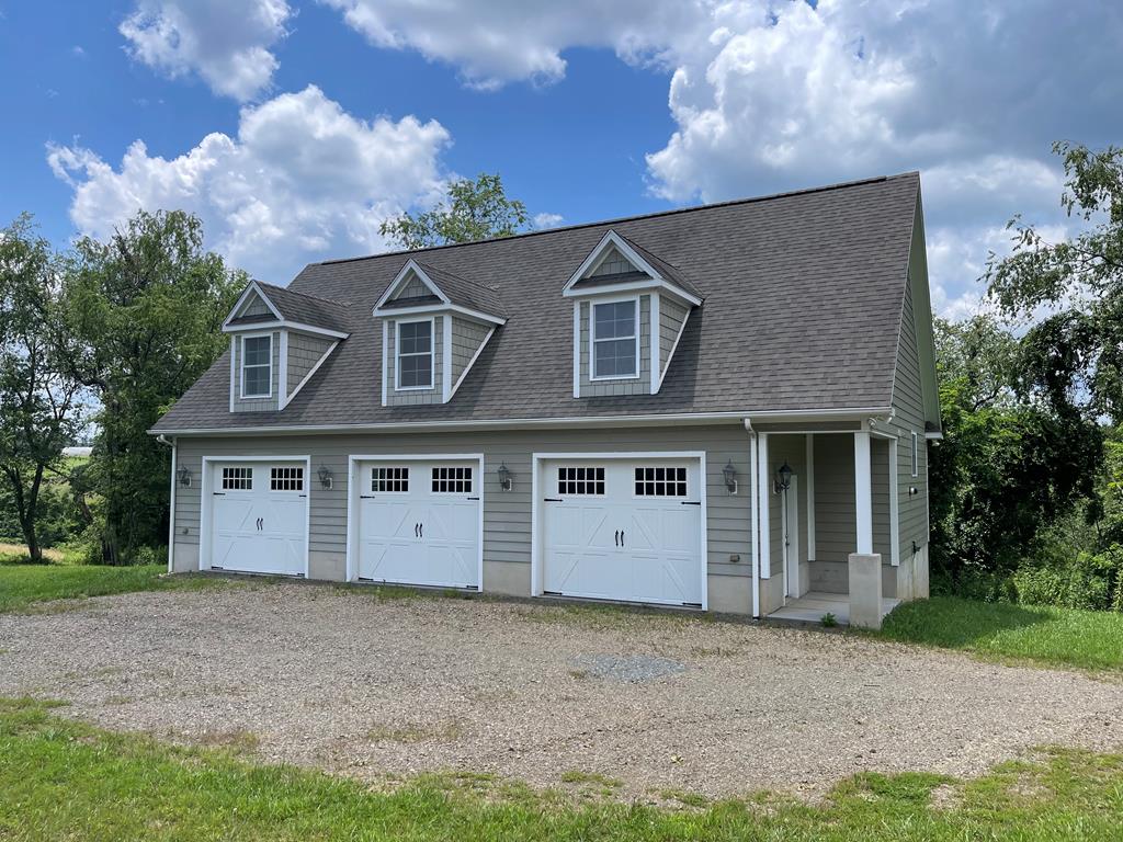 Come build your dream home on top of this private and secluded hilltop in Carroll County Va. or move in now and build later in this 3-car garage with an apartment on the upper level on 24 acres with Coal Creek running right through the middle of the property. The land has a bold creek, pastureland, plenty of road frontage and privacy. Apartment is like new with a large living room and kitchen area with hardwood flooring, spacious bedroom with carpet, and a full tiled floor bath. On the lower level you have a finished oversized 3 car garage with cabinets and plenty of electrical outlets and a half bath. with some tree trimming you could have a countryside view of all the beautiful hillsides and valley around. Or keep the spot on top and develop all the road frontage into nice lots with creek frontage and return some of your investment. Either way it is a beautiful place close to Galax City, Hospital, Walmart, New River and trail, or the Blue Ridge Parkway. Come and see!