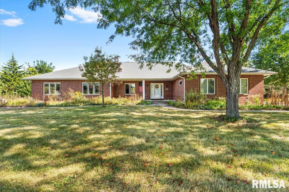 This incredibly well maintained custom built all brick 3-4 bedroom, 2.5 bathroom ranch home with a 3.5 car attached garage sits on a gorgeous partially wooded 2.5 acre lot complete with walking trails and wild flowers. Every room in this 3000+sq' home is very large with an abundance of spacious closets. If that isn't enough room for you there is also a partial unfinished 1664sq' basement ready to be finished (with plumbing roughed in for another full bath) or for more storage space. Among the many notable updates you will appreciate the newer roof and skylight installed in 2023, two newer central air condensors 2021 & 2025, and new dishwasher in 2025. Other great features include: the home Generac Generator (selected circuits), all of the kitchen appliances including the washer and dryer stay with the home, custom window blinds, oak wood floors and millwork with crown molding in two rooms, three sets of French doors, numerous large casement windows overlooking the prairie landscape and woodlands, 3 pocket doors to maximize space, gas grill outdoors just recently serviced and in great shape and more! Enjoy your private park like setting while sitting in your sun room or in the screened porch (which is on a concrete foundation) or on your large concrete back patio. There is not another home like this available in the Rochester School district. Potential 4th bedroom could be a formal dining room, den or bedroom.  Contact your favorite Realtor today to schedule a tour.