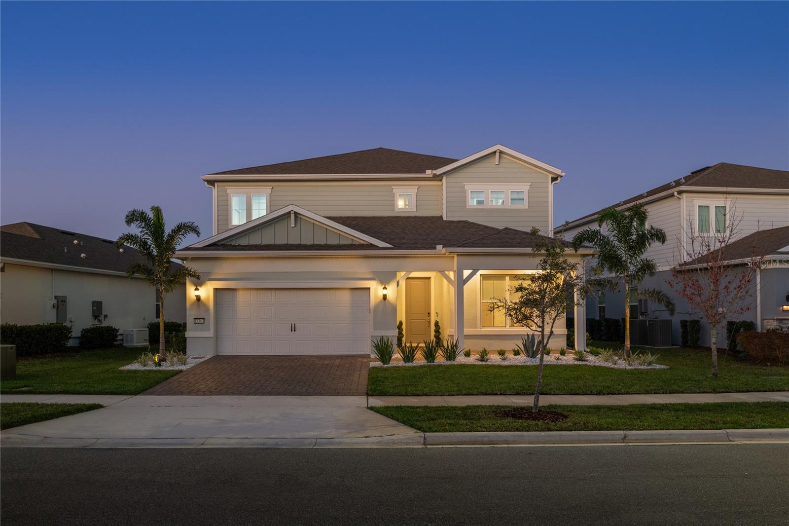 Tucked within the gates of the highly sought-after Isles of Lake Nona, this home presents a beautifully designed residence featuring the privacy of no rear neighbors. Inside, the main living area immediately captures attention with its stylish custom entertainment center featuring LED backlighting and a sleek electric fireplace, creating a striking focal point that elevates the entire room. Natural light pours through expansive windows, while the open-concept design allows the living spaces to flow effortlessly into the kitchen and outdoor areas.The chef’s kitchen is both functional and visually impressive, appointed with quartz countertops, top-of-the-line stainless steel appliances, a spacious center island with seating, and a stunning mosaic tile backsplash that adds texture and character.  One of the home’s most impressive features is the seamless connection to the outdoors. Expansive pocket sliding doors open completely to the covered lanai, creating a true indoor-outdoor living experience that is ideal for entertaining or simply enjoying Florida’s beautiful year-round sunshine. The primary suite serves as a private retreat, offering a spa-inspired bathroom featuring a large walk-in shower, dual vanities, and elegant finishes, while the expansive custom closet with built-in organization provides both style and practicality. Step outside to your own private outdoor oasis. The covered lanai with retractable screening allows you to enjoy the space comfortably year-round, while the spacious pool deck and beautifully designed pool area provide the perfect setting for relaxation or entertaining guests. With no rear neighbors, the backyard offers an added sense of privacy rarely found in the area. Living in Isles of Lake Nona means enjoying a true resort-style lifestyle. Residents have access to a beautifully designed clubhouse, a fully equipped fitness center, a resort-style pool complete with splash pad, multiple playgrounds, and sports courts for basketball, tennis, and pickleball. The community’s prime location places you just minutes from Lake Nona Town Center, Medical City, the USTA National Campus, top-rated dining, shopping, and entertainment, making it one of Orlando’s most dynamic and desirable areas.