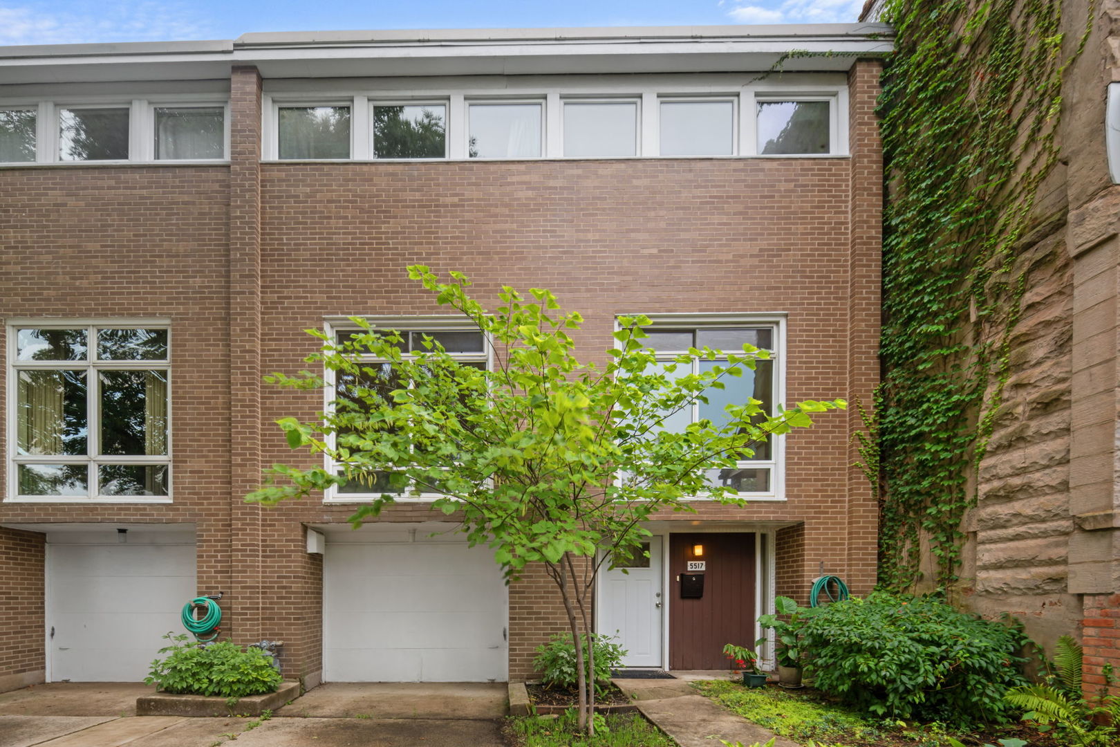 Looking for space, light and convenience? Find it in this Harry Weese mid century gem. This F simple townhome offers 2,568 sq. ft. of livable space. Large bright living room with original parquet floor in mint condition and fireplace, additional Living room/ library space, with separate dining room, and powder room. Upstairs features 4 generous sized bedrooms and two baths with original 1960's fixtures for the mid century aficionado. Downstairs family room/ additional 5th bedroom, laundry and mechanical. Plenty of storage, attached one car garage with tandem parking outside, east side of home has new windows, entire home was tuck pointed in 2024, newer A/C and furnace. Large backyard 25 by 47 ft. Kitchen needs updating, but has newer quartz countertops and the hood vents outside. Welcome home!