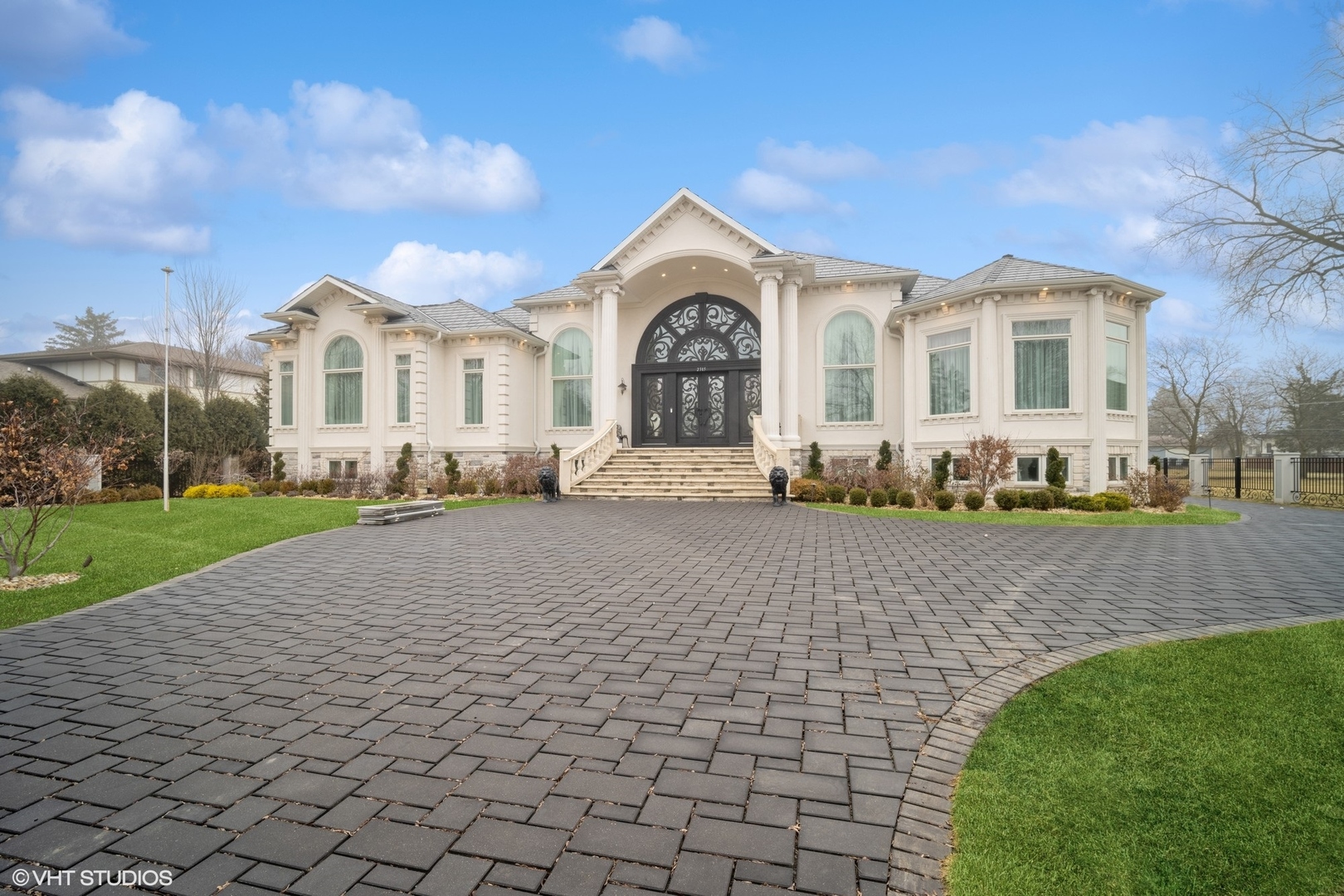 A home unlike any you have ever seen before. This custom built estate like property was designed to surpass even the highest expectations.  Elevated to new level of grandeur with the best in class finishes throughout. This traditional inspired masterpiece delivers a true formal entryway with a handcrafted 14 foot iron double door.  Exquisitely tailored kitchen with dueling islands, furniture grade cabinets, marble countertops, professional grade appliances, built-in coffee bar, walk-in pantry and eating area. Butler's pantry leads to a world class dining room with views of sprawling living room open to an incomparable great room accented with handcrafted fireplace.  Breathtaking primary suite with two separate closets offering designer organizers. Deluxe private bathroom with dual vanities, soaking tub and separate spa-like bath. Walk-out full finished basement offers second full kitchen, second laundry room, wet bar, movie theater, display room, recreation room and game area. 18 foot first floor ceilings, jaw dropping millwork, chandeliers galore, paver patio, driveway and walkways.