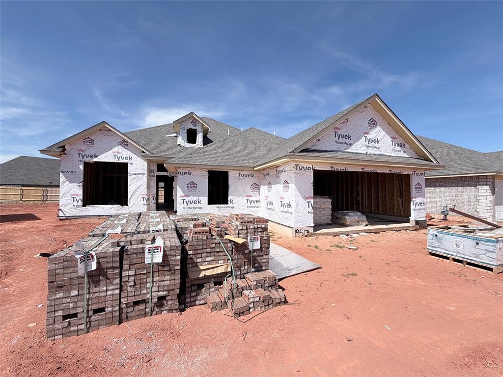This wonderful new home has an open, inviting layout. Warm wood tile runs throughout the hallways and main areas. The kitchen comes with custom wood cabinets, under cabinet lighting, a large island, thick quartz tops, decorative wood vent hood, stainless steel Samsung built-in appliances, large pantry, and more! The large living room features a stunning fireplace with floating mantle. There is a quaint and useful tech area as you head towards the spacious primary bedroom. The primary bath has a large tiled shower, raised two sink vanity, enclosed toilet and the closet is very large. All of the spare bedrooms are spacious with good closet space. The utility has a built-in linen. Fence included! Neighborhood amenities incl a pool, large playground and clubhouse with fitness center and gathering hall!
