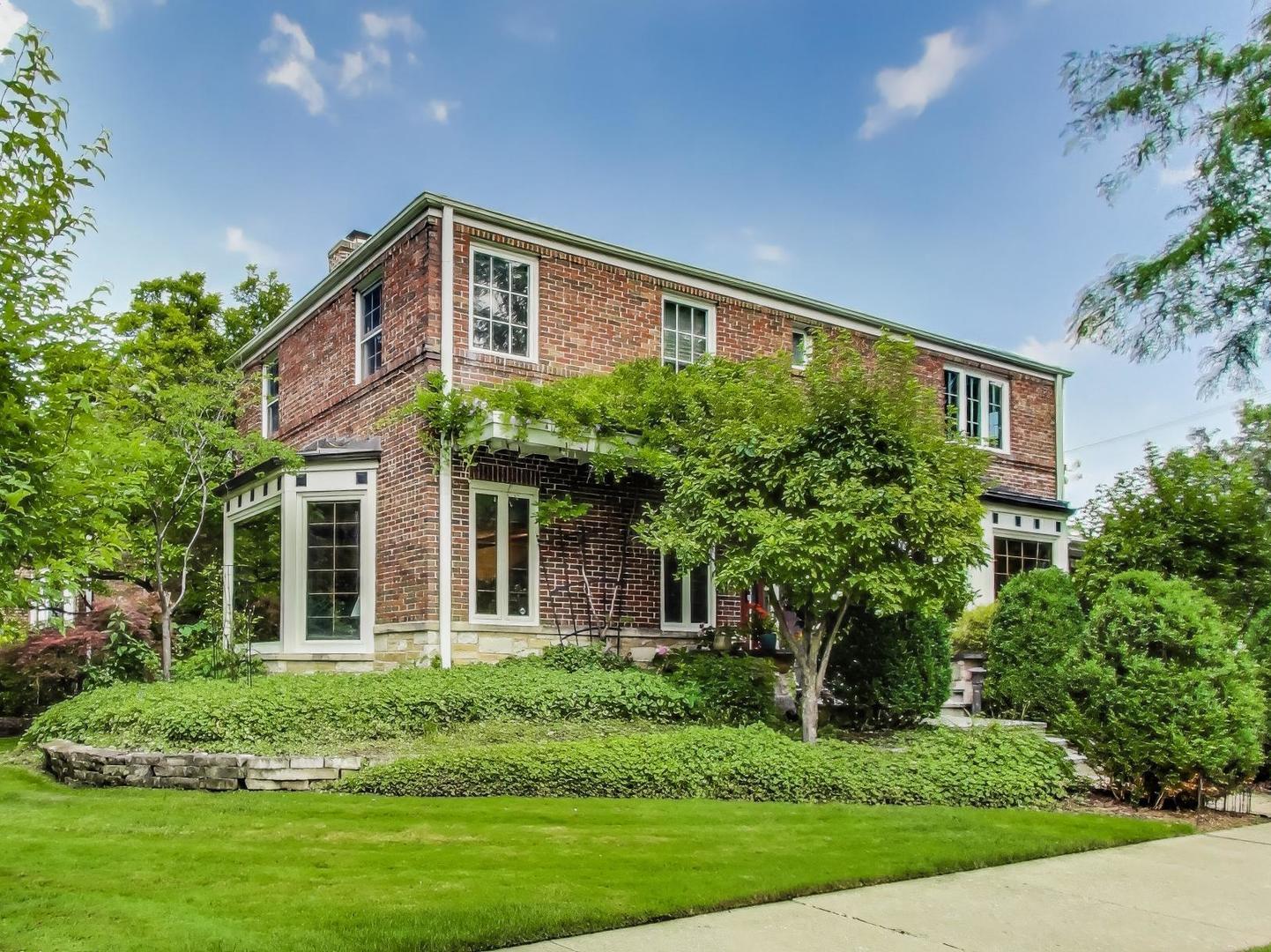 Elegant Georgian Residence on a Premier Double Corner Lot Across from Peterson Park. Welcome to this beautifully updated Georgian home, perfectly positioned on a rare double corner lot directly across from the natural beauty of Peterson Park and the North Park Nature Preserve. Radiating timeless charm and modern comfort, this spacious, light-filled home offers 3 bedrooms, 2 full baths, 2 half baths, and thoughtfully curated custom living spaces throughout. The inviting main level is designed for effortless entertaining, with an open layout that flows seamlessly from room to room. The formal living room showcases a stately wood-burning marble fireplace framed by a hand-carved oak mantle, and an oversized bay window that offers serene park views. Rich Brazilian Angelim hardwood flooring sweeps through the entryway, encircling a dramatic custom stone medallion. The formal dining room delights with a newly refinished original parquet floor and a sun-drenched south-facing bay window. The chef's kitchen is equipped with high-end stainless steel appliances, sleek countertops, and a charming built-in breakfast nook-perfect for casual mornings or intimate gatherings. Retreat upstairs to a spacious primary suite with vaulted ceilings, a luxurious marble bath featuring a soaking tub, walk-in glass shower, and a custom walk-in closet outfitted with built-in drawers, shelving, and seasonal storage. The finished lower level includes a cozy recreation room with a second wood-burning fireplace, a full laundry area, and built in's offering ample storage. Additional features include a whole-house air filtration and humidification system, two-car garage, and lush landscaped grounds. A truly special home that combines classic architecture, modern elegance, and an unbeatable location.