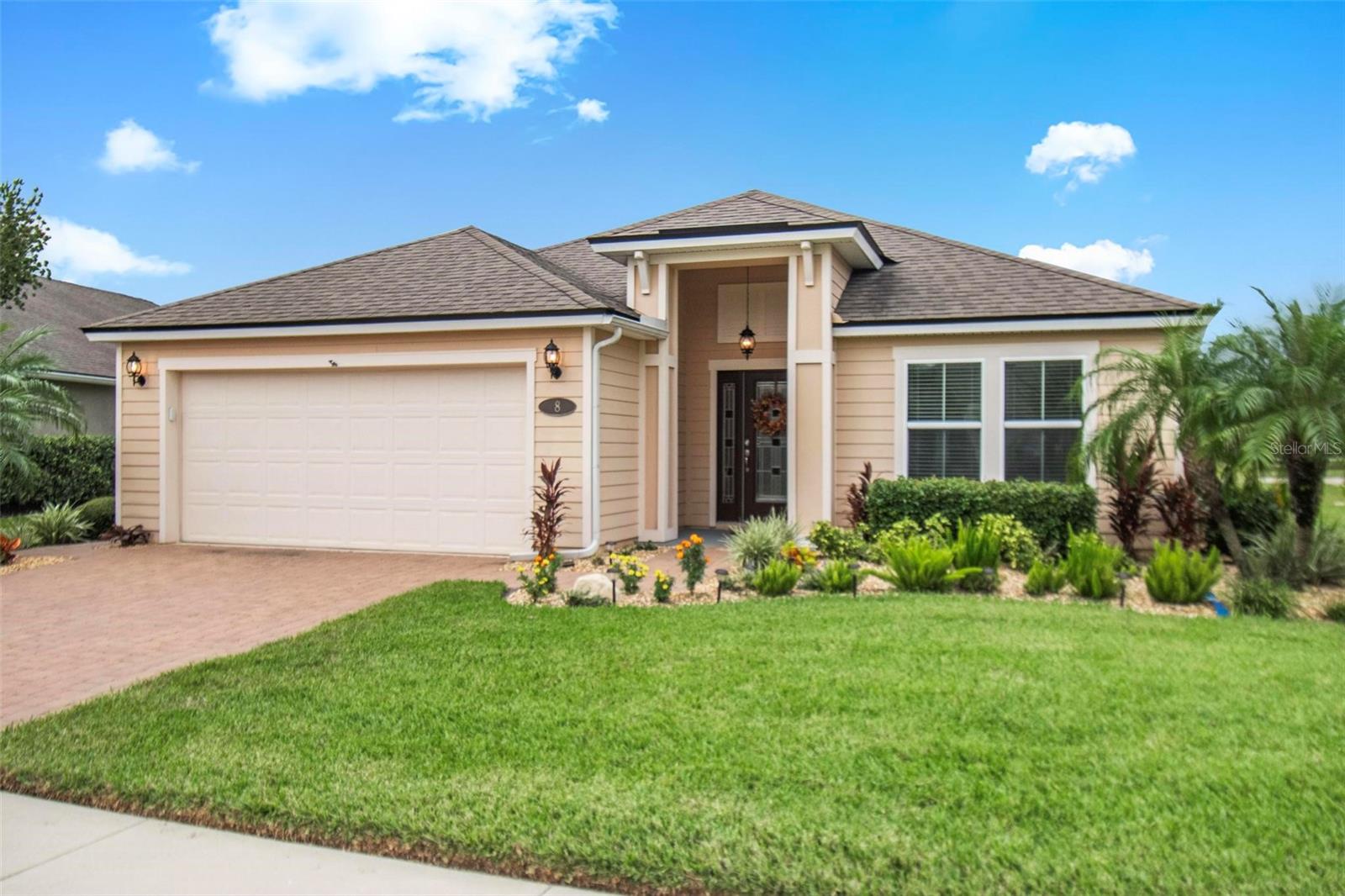 This one has it all: water and golf course views, two primary suites, location within walking distance to the Intracoastal Waterway, European Village and local marina, community access to the canals for kayaks and a huge lanai and heated saltwater pool/spa.  It’s the best of Florida living!  Built in 2018, this home is located in Country Club Harbor, a gated community with sidewalks as well as a community pier and kayak launch area.  Convenient to schools, stores, restaurants, local golf course and walking trails, this property features plenty of storage spaces with walk-in closets in the two primary bedrooms and attic access with pulldown stairs and flooring.  The finished garage floor, the large hanging storage shelves in the garage and the A/C in the garage add to the functionality of the garage space.  Both the driveway and the lanai are finished with brick pavers; the huge lanai (22 X 40) has a large covered area as well as a  bar area for outdoor entertaining.  The spacious salt water pool is 18 X 30 with a spa and a Hayward control panel for accessing the pool features inside the house - not to mention a gorgeous water and golf course view.  Granite kitchen counters with a kitchen island, walk-in pantry, and dual stainless steel sinks add to the beauty of this property. If you are considering a second home purchase, the furnishings are negotiable.