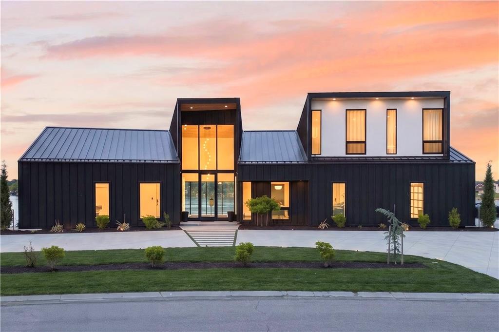 Experience the pinnacle of lakeside luxury at 16 Seminole Circle, a masterfully crafted contemporary estate on the premier shores of Lake Winnebago. Completed in 2021, this architectural masterpiece spans roughly 7,300 square feet of meticulously designed living space, where soaring ceilings and floor-to-ceiling glass walls create a seamless connection between the sleek interior and the sparkling waterfront. The open-concept floor plan is an entertainer’s dream, featuring high-end designer finishes and a gourmet kitchen that flows effortlessly into expansive living areas. Each of the 5 spacious bedrooms and 5 spa-like bathrooms offers unparalleled comfort, while the primary suite provides a private sanctuary with panoramic lake views. The outdoor oasis is truly second to none, displaying a private pool set against the backdrop of the water and a pristine lakefront lot perfect for enjoying the vibrant sunsets. This is a rare opportunity to own a nearly new, ultra-modern retreat in one of the region’s most exclusive communities.