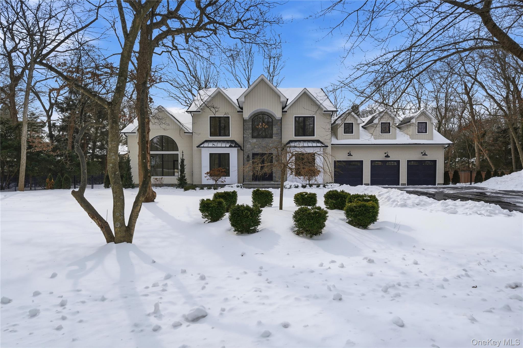 Welcome and enjoy this 5 bdrm/5.5 bth Custom Colonial. 115 Weeks Drive stands as a builder’s own masterpiece — a private luxury estate tucked deep within Dix Hills is designed with intention and built with uncompromising quality, this residence delivers a level of refinement and comfort rarely found at any price point.Set on a private, park-like grounds, the property immediately distinguishes itself with an extraordinary 5-car garage that presents as a classic 3-car from the front. Behind a collector’s dream: soaring ceilings and exceptional depth, offers the perfect environment for multiple car lifts and expanded vehicle storage. For the automotive enthusiast, this is a rare find.Inside, the home unfolds with dramatic scale. A grand 2-story foyer with white oak floors and a sweeping staircase sets a tone of elegance from the moment you enter. The chef’s kitchen is a showpiece, anchored by a 10-ft marble island and outfitted with custom cabinetry, a Wolf 6-burner stove with grill, double ovens, Sub-Zero refrigerator and freezer, wine fridge, ice maker, and a walk-in pantry — a true culinary dream.The formal dining room and first-floor guest suite/office feature exquisite molding and beautiful views, while the soaring family room elevates everyday living with custom ceiling details, a striking fireplace, and sliding doors that open to a covered patio with its own wood-burning fireplace — a year-round outdoor sanctuary.Upstairs, the primary suite becomes a private resort, complete with a terrace overlooking the heated saltwater pool and a spa-inspired bath with radiant floors. Each additional bedroom offers its own ensuite bath with radiant heat, ensuring comfort and privacy throughout.A 1,500 sq ft basement with outside entrance, mudroom, new cesspool, propane heat (3 zones), and professionally landscaped grounds — including space for a pickleball or sports court — complete this exceptional offering.A rare fusion of luxury, craftsmanship, and lifestyle, 115 Weeks Drive is more than a home — it is an estate designed to impress and built to endure.( Some photos are Virtually Staged)