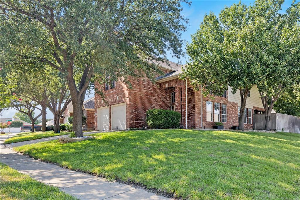 LOOKING FOR A GREAT HOME! This 4 bedroom, 2.5 bath sits on a desirable corner lot in the outstanding Keller ISD. The home has just been freshly painted and features new sod and landscaping all around, giving it fantastic curb appeal! Enjoy the open concept layout with beautiful bamboo flooring throughout, an oversized game room upstairs, and a loft area that's perfect for a computer or homework space. One bedroom is located separately downstairs-ideal for a teenager or mother-in-law suite. Garage doors were replaced in 06-22, and solar screens have been added for improved energy efficiency. A new roof and new AC unit were also recently installed. The shady backyard with mature trees is great for relaxing ot entertaining. Conveniently located near trails, playgrounds, creeks, basketball courts, shopping, restaurants, and parks. This home has it all!