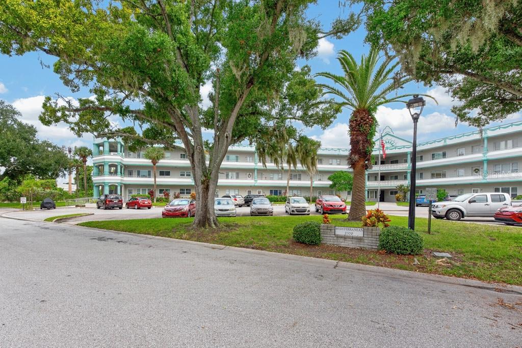 Tucked into the sought-after On Top of the World 55+ community, this well-maintained 2-bedroom, 2-bath residence offers 1,100 square feet of comfortable living space with a layout that feels open, functional, and easy to enjoy. The spacious living and dining areas flow naturally together, creating plenty of room for quiet evenings at home or gathering with friends and family. The kitchen offers abundant cabinetry, generous counter space, a ceiling fan, and a dedicated eat-in area for casual meals or morning coffee. The primary suite provides a private place to unwind, complete with ample closet space and an en suite bath. A second bedroom and full bath offer flexibility for overnight guests, a home office, hobby space, or whatever best fits your lifestyle. One of the home's standout features is the enclosed Florida room, adding valuable extra space that can be enjoyed throughout the year. Use it as a reading room, sitting area, game room, craft space, or simply a comfortable spot to relax and enjoy the Florida lifestyle. Living in On Top of the World means more than just having a place to call home. Residents enjoy an active, resort-style community with golf, swimming pools, fitness facilities, walking areas, clubhouses, social clubs, activities, and recreation designed for a wide range of interests. Whether you're looking for a full-time residence, seasonal escape, or an easy-to-maintain home in an established 55+ community, 2370 Jamaican Street, Unit 30 offers a comfortable setting, versatile living space, and access to one of the area's most popular active-adult lifestyles.