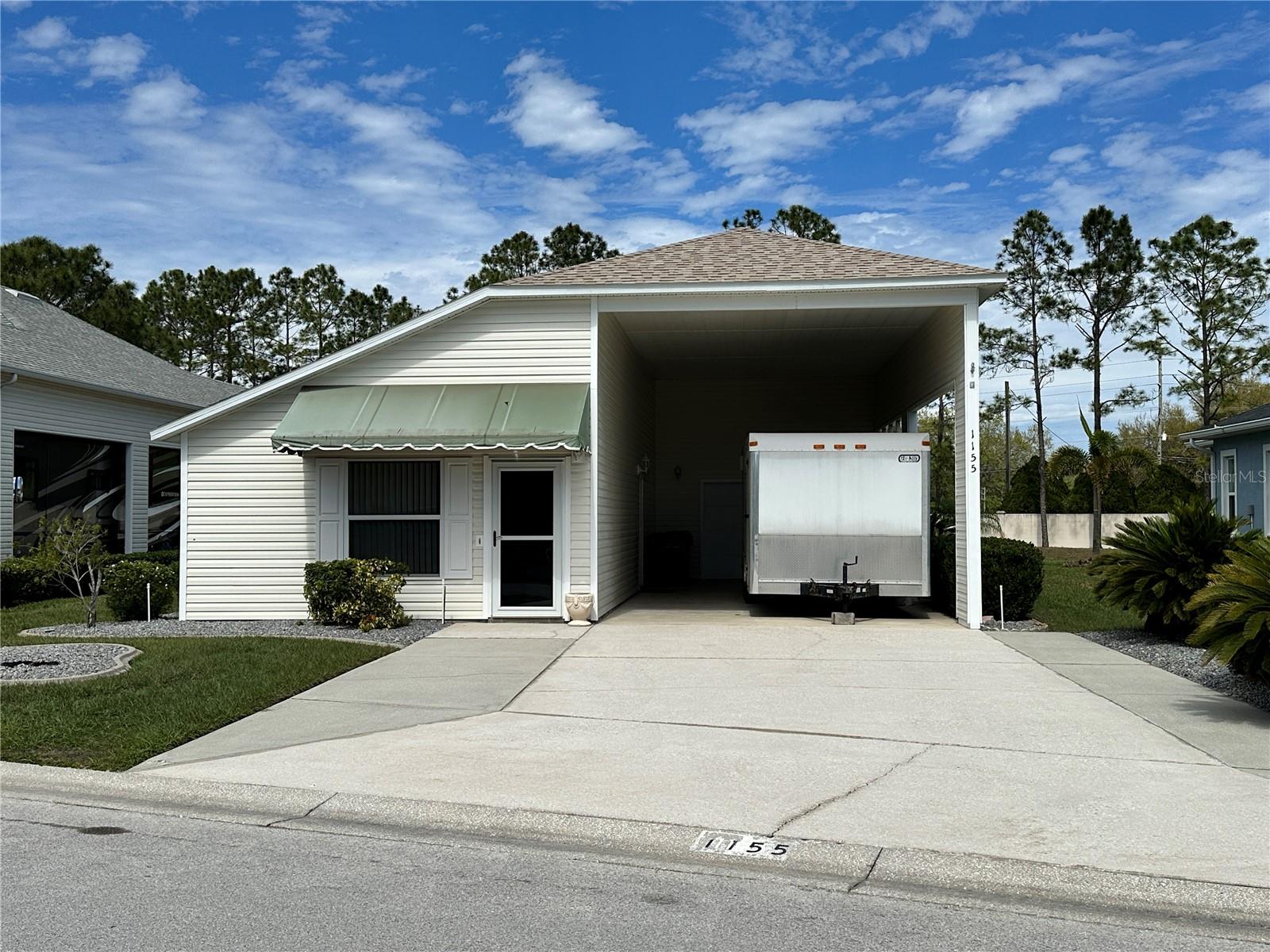 This home in the sought after community of Mt. Olive Shores North is perfect for your winter getaway. It is a one bedroom and 1 bathroom with a full kitchen and living room. The flooring in the living room and kitchen have recently been upgraded as well as all of the appliances in 2022. The roof was replaced in November of 2022 and the A/C unit in 2013. The RV port measures approximately 40' X 15.6" and has a air conditioned single car garage for the extra tools and space for the golf cart. Beyond the master bedroom is a flex space that would be perfect for a workout room or desk for remote working. Call today for an appointment to see this one.