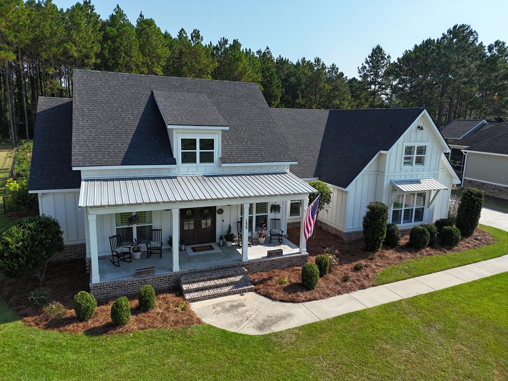 Take a look at this STUNNING 4BR/2.5Bath home in Sweetbriar Lakes, Thomasville GA! Beautiful inside and out, THIS is the home you have been looking for. The gorgeous layout inside features soaring cathedral ceilings, wide open living space, big beautiful windows and amazing architectural touches. The kitchen is PERFECT with fabulously functional counters and cabinets, the latest appliances and a big walk in pantry. The primary suite features a luxurious bathroom with big tub, double vanities, separate shower and an amazing walk in closet. On the other end of the house there are 3 more nice bedrooms, and a HUGE upstairs space that can double as a 5th bedroom, family room, home office and MORE. Step out the backdoor to your own private oasis. There is a screened porch leading out to an inviting pool space, complete with palm trees and an incredible seating area. Home has tons of curb appeal with plantation shutters, professional landscaping, raised beds, and upscale lighting. Do not miss your chance to own this STUNNING HOME. Call your favorite agent TODAY for a closer look.