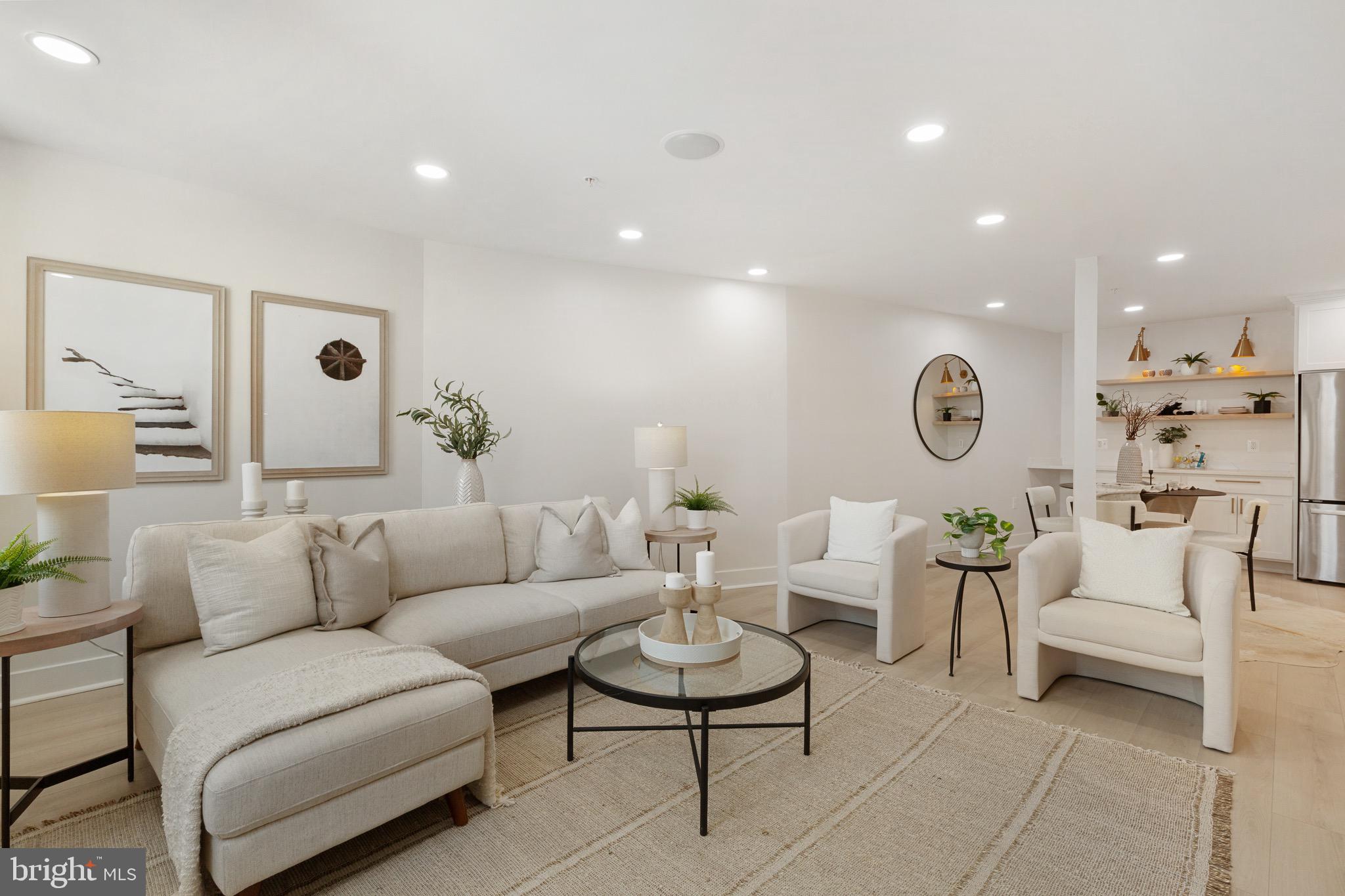 Welcome to 1601 Portugal St in Fells Point. This stunning newly built row home with parking blends modern luxury with historic charm. Featuring three bedrooms and three-and-one-half baths, this four-level residence offers the perfect balance of comfort and style. Boasting 2,100 square feet, the open floor plan was designed with many exquisite appointments and quality finishes throughout including wide plank white oak flooring, recessed/designer lighting, custom staircase, and custom tile. The first floor greets you with an entry foyer and guest bedroom with a walk-in closet and full bath. The second level and spacious main level comprise the living/dining room, kitchen, powder room, and laundry room, fit to entertain with an integrated speaker system. The gourmet kitchen is equipped with a quartz waterfall island, seamless quartz backsplash, high-end appliances, custom lighting, and ample countertop/cabinet storage. The third level features a second bedroom with a full bath and a separate den which serves as a great home office or bar area with direct rooftop deck access. One of the highlights is the rooftop deck with Trex decking, where you can unwind or entertain. The fourth level is dedicated to the primary suite featuring a spacious bedroom, walk-in closet, and luxurious spa bath with a custom oversized shower featuring Calacatta marble. Enjoy private deck access with breathtaking skyline views of Harbor East and beyond. In addition to its exceptional interior, this rowhouse offers the convenience of garage parking. Located in the heart of Fells Point. Explore the vibrant neighborhood with eclectic dining options and lively entertainment venues. With easy access to nearby attractions and a convenient location, this address provides the perfect blend of urban convenience and neighborhood charm. Conveniently located to historic Fells Point, Canton, Harbor East, restaurants, shopping, and major highways.