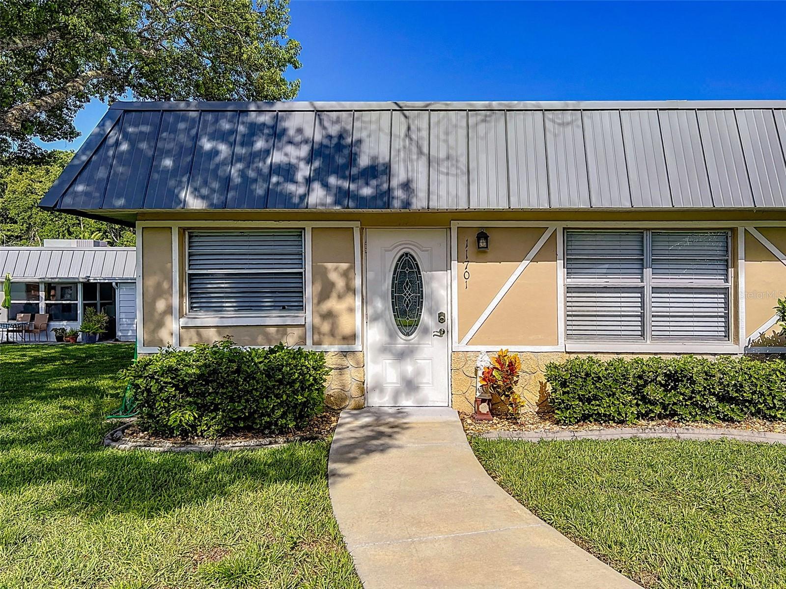 The welcoming and active, pet friendly, 55+ community of Paradise Pointe in Summertree is where you want to be!  This single-story 2 bedroom/2 bath condo is lovely and well maintained with covered parking, and a view of a park like setting across the street.  Condo fee includes grounds and building maintenance (including roof), cable (including Disney+, HBO Max, Peacock, Paramount+, DVR), internet, trash pickup, and outside pest control. Activities abound in this community, the clubhouse contains a fitness center, sauna, steam room, pool, jacuzzi, card game room, billiards hall, media room, and library. Dances and shows are often offered in the large auditorium and if that isn't enough, there are also tennis, pickleball, and shuffleboard courts, bocci ball, horseshoes, plus a golf course, what more could you ask for?! Don't miss out on the chance to be part of this community and to make your new home your own personal oasis!!  Furniture can be purchased separately.