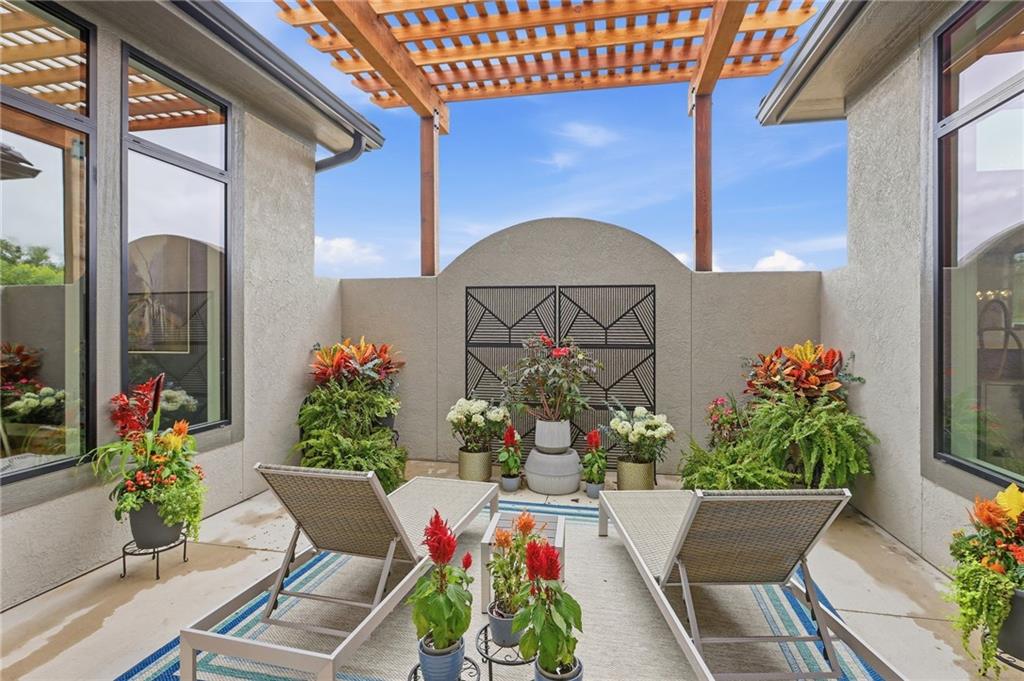 The Courtland Reverse by Don Julian Builders. So much WOW! Fabulous plan with a distinctive "pub" and private courtyard with pergola creating a standout focal point for entertaining. Also perfect for relaxing and enjoying nature! Useable, large first floor study/den adds flexibility and views this indoor/outdoor space! Open, main living area centers around a jumbo kitchen island, walk-in pantry and seamless gathering places. Terrific vaults and beams in great room AND dining. The secluded primary bedroom suite features spa-like bath, free standing tub and laundry ROOM off the huge closet. Secondary main level bedroom (w/private bath) for added convenience. Drop station/mud room with cubbies by back door. Hidden, back stairs to Lower Level, expanding the home's entertaining potential with two large recreation spaces and stylish wet bar built for hosting. TWO additional, sizable bedrooms, each with their own bath and walk-in closet. SO much light! FOUR-car garage. Enjoy Riss Lake amenities: including 3 pools, tennis courts with pickle ball lines, playground, splash pad, walking trails, basketball and sand volleyball. 134-acre lake for fishing or boating, more!