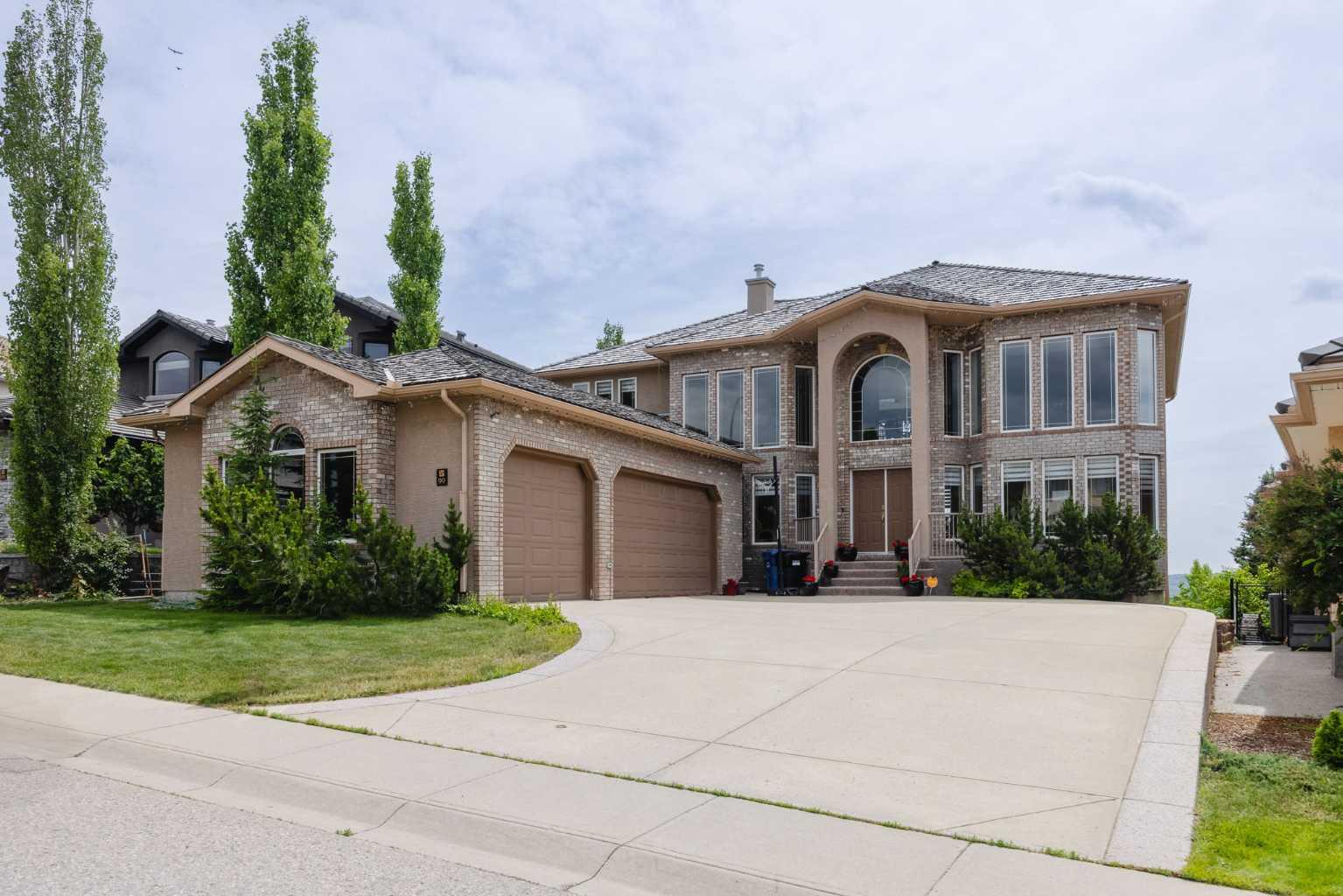 An OUTSTANDING OPPORTUNITY to own a Grand Family HILLTOP Home with VIEWS to  Mountains, COP & Downtown from  both levels & basement in a Desirable community of ARBOUR LAKE. Living same family since Custom built, Awe inspiring & Luxurious Walkout Home wi living area 5600sft plus, Open to below 900sft is flooded by Natural lights. MAIN FLOOR : Open to below wi formal Living & Dinning room on the sides, Ensuite Master bedroom & Family room Open to below leads to Sunny South side Backyard & Huge deck, Spacious kitchen, Mini bar, Office, Powder room & Laundry cum Pantry including cabinets and a Attached Triple garage. SECOND FLOOR : Ensuite Master bedroom, 2 Bedrooms with jack & Jill bath & Reading nook/ work station . BASEMENT : Two Bedrooms, Full bath, Half bath, Media room, Games room, Rec. room,  Bar, Dinning room & Spiced kitchen (without permit) leads to another Deck &  South backyard. Walking distance to Lake, Shopping center, Park, Playground & Schools are nearby. Floor Plan attached to supplements. Checkout 3D tour, Video & Photos for interiors. Exceptional CRAFSMANSHIP.