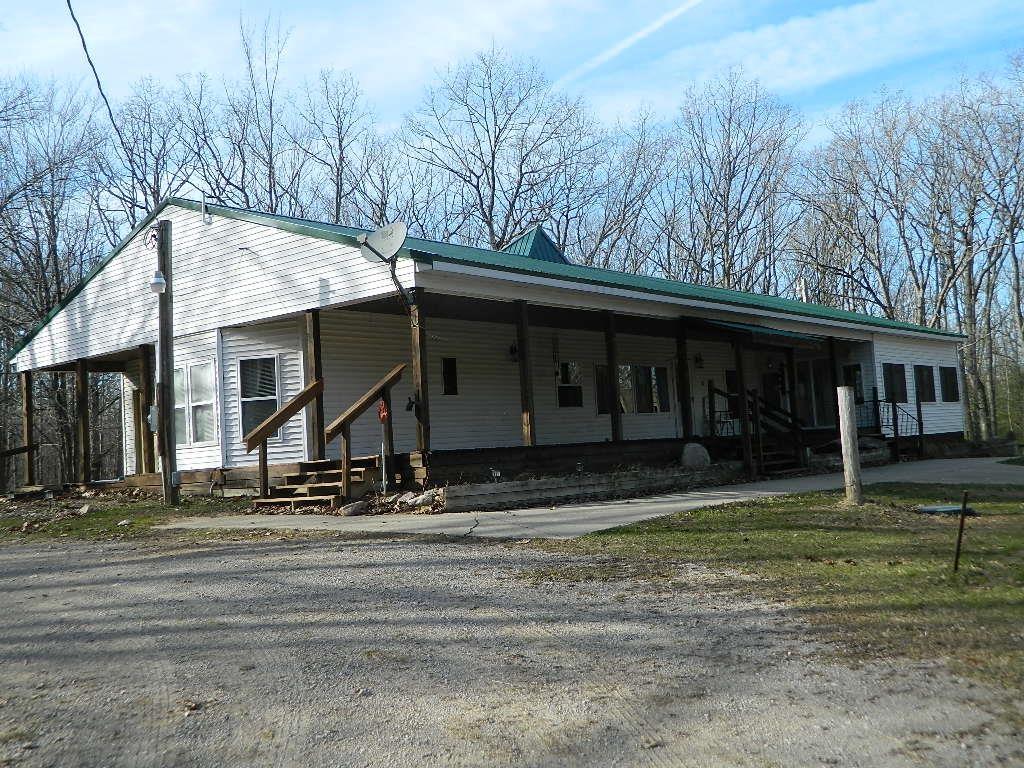 Looking for wooded acreage, maybe a hunting camp? 29.5 acres of mature mixed hardwoods with trails throughout. 4 bedrooms, 3 full baths with additional sleeping rooms in the full, walkout basement. With over 100 acres of State land directly across the road, this is a hunting and outdoor sports enthusiast dream property. ATV on your own property or on miles and miles of county roads. Stripped to the studs in 2024 and rebuilt in 24/25. Over 2000 sq ft and a full walk out basement with more sleeping rooms. Both wood and LPGFA furnaces, newer metal roof, plumbing and electrical. This place is ready to go. Located a few short miles from the N Harrison exit from highway 127 the towns of Houghton Lake, Clare or Harrison are a short drive. The large steel barn, with concrete floors and electricity can house your equipment, cars, horses and even a chicken or two. Set up for relaxing and fun...take a look.