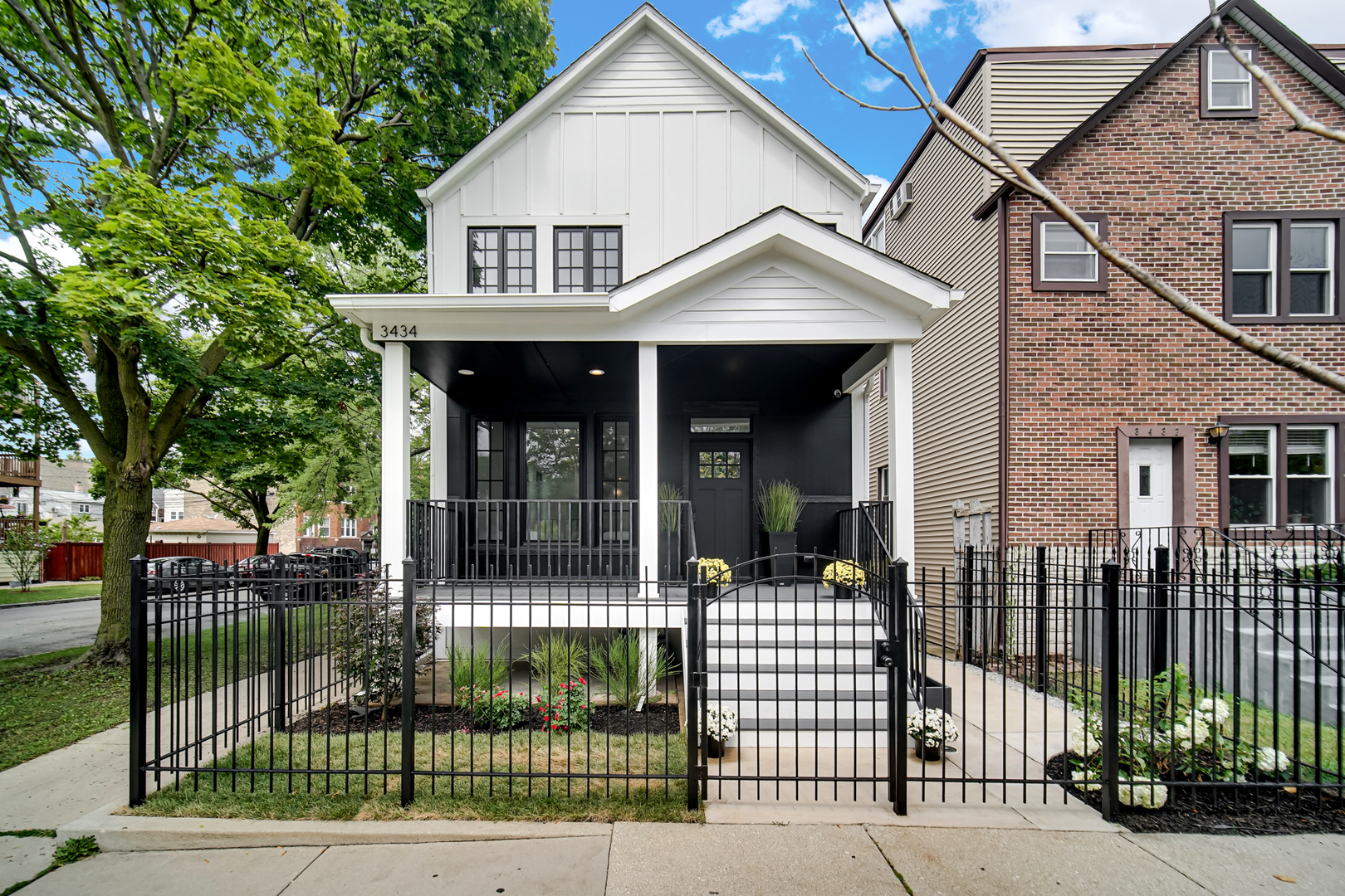 Welcome to your dream home in the heart of Logan Square, a modern single-family residence that blends luxury with thoughtful design. Perfectly situated on a corner lot, this 5-bedroom, 3.5-bath home offers the ideal balance of sophistication, comfort, and convenience. The chef's kitchen is a true showpiece, featuring a 60" Wolf range, SubZero refrigerator, Bosch dishwasher, dual sinks, and Italian countertops. Custom metalwork, designed exclusively for the home, frames the open-concept kitchen and living area, while custom cabinetry surrounds the refrigerator for a seamless, modern look. Elegant lighting and finishes from Restoration Hardware bring a refined touch of luxury throughout.    Upstairs, 6 skylights fill the vaulted ceiling hallways and bedrooms with natural light, creating bright and airy spaces. Four spacious bedrooms provide room for family and guests, while the lower level extends the living space with a fifth bedroom, a sleek wet bar, and a dog wash station. A thoughtful detail for pet lovers, the back entrance even includes a "dog apartment," perfect for keeping paws clean and organized. Throughout the home, integrated speakers set the perfect ambiance for everyday living or entertaining.    The exterior is equally impressive, with crisp white siding, bold black Marvin and steel windows, and striking black accents. Outdoor living abounds with a welcoming front entrance deck, a private balcony off the primary suite, a designer patio, and a spacious rooftop deck above the 2-car garage.    Located near Palmer Square Park, the 606 Trail, and the vibrant dining and shopping scene of downtown Logan Square, this home offers both a family-friendly environment and sophisticated city living. Whether hosting a gathering or enjoying a quiet evening at home, this residence was designed for those who appreciate quality, style, and comfort.