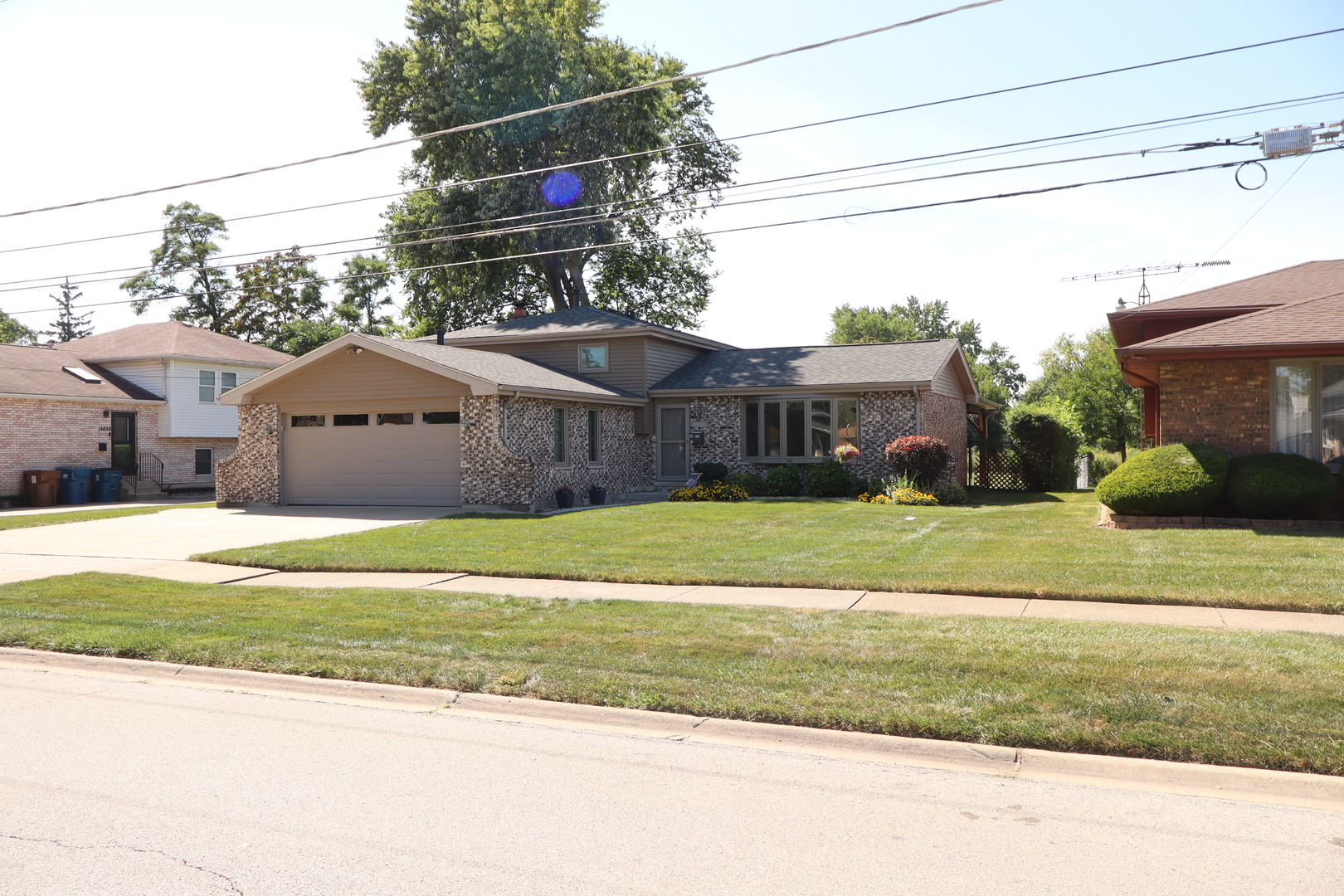 A VERY CHARMING DECORATED AND CLASSIC SPLIT LEVEL ON A PRIME MIDLOTHIAN LOT. THIS OVERSIZED LOT BACKS UP TO A WIDE OPEN NATURE AREA FOR PRIVACY. ENJOY THE QUIET NIGHTS ON A BEAUTIFUL 21X13 COVERED PATIO WITH A STAMPED CONCRETE FLOORING , TONGUE AND GROOVE CEILINGS AND ELECTRICAL FOR A FAN AND ENTERTAINING. THIS EXCEPTIONAL HOME BOASTS 3 BEDROOMS AS WELL AS "3 FULL" BATHS. LARGE 20X12 FAMILY ROOM WITH A GAS FIREPLACE. OVERSIZED LAUNDRY ROOM FOR ADDITIONAL WORK AREAS. SUNRISE CASEMENT PELLA WINDOWS(2024). FIRST FLOORING UPDATES THROUGHOUT(2022) ROOF(2020), AS WELL AS VINYL SIDING(2019). FURNACE(2017). SHARP CONCRETE COATING FLOOR IN THE 2 1/2 CAR GARAGE(2024) WITH AN OVERSIZED CONCRETE DRIVEWAY. THIS LOT WITH THE  OVERHEAD PATIO AND LANDSCAPING WILL SELL YOU ON IT'S OWN.