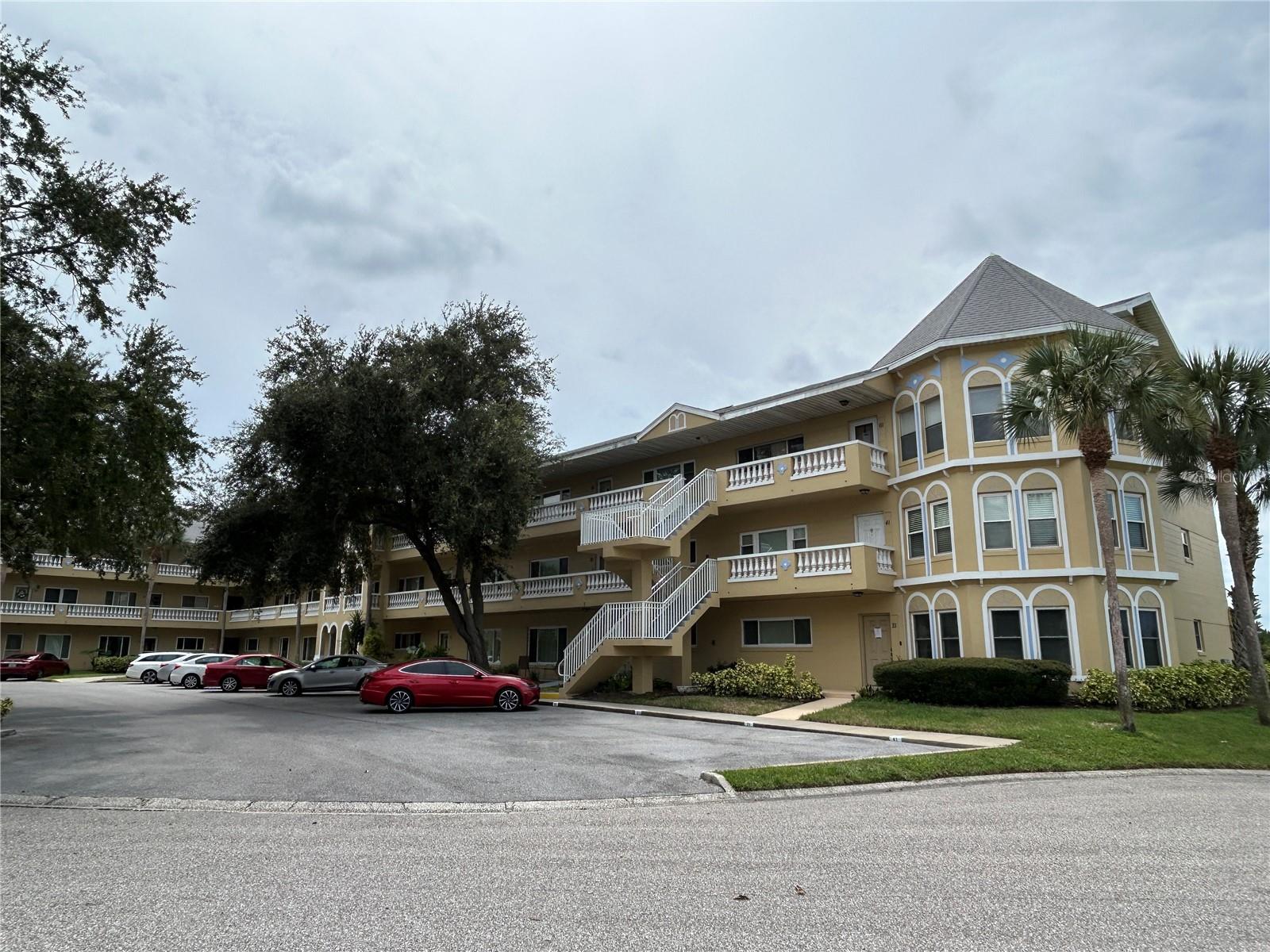 What a view! With its prime location overlooking Harbor Lake, this third floor Grande, with 2 large bedrooms and 2.5 bathrooms, boasts vaulted ceilings and updated windows. Both bedrooms have private ensuite bathrooms and huge walk in closets. You will enjoy the convenience of the full size washer and vented dryer in the built in laundry room, and the AC was replaced in 2023.  Located in a vibrant 55+ community, you’ll have access to a wide range of amenities designed to enhance your lifestyle. Enjoy two private golf courses (9 and 18 holes), two heated swimming pools, and two activity centers. Stay active in the remodeled cardio gym or engage in various community activities like fitness classes, dancing, clubs, cards, and billiards.  Pet owners will love the pet-friendly environment, featuring a fenced dog park and covered seating areas. Residents can also enjoy hobby studios and a woodshop for creative pursuits. The on-site Good Karma Café offers convenient take & bake meals and snacks.  Conveniently located near beaches, transportation, shopping, entertainment, and fine dining, this condo perfectly combines comfort with accessibility. Please note that all room sizes, floor plans, and square footage are approximate. This property is being transferred by a leasehold estate deed, and association approval is required. If financing, a 35% down payment is necessary.  Don’t miss this fantastic opportunity to own a contemporary condo in a prime location, offering an exceptional lifestyle with easy access to a wealth of amenities. Schedule your showing today!