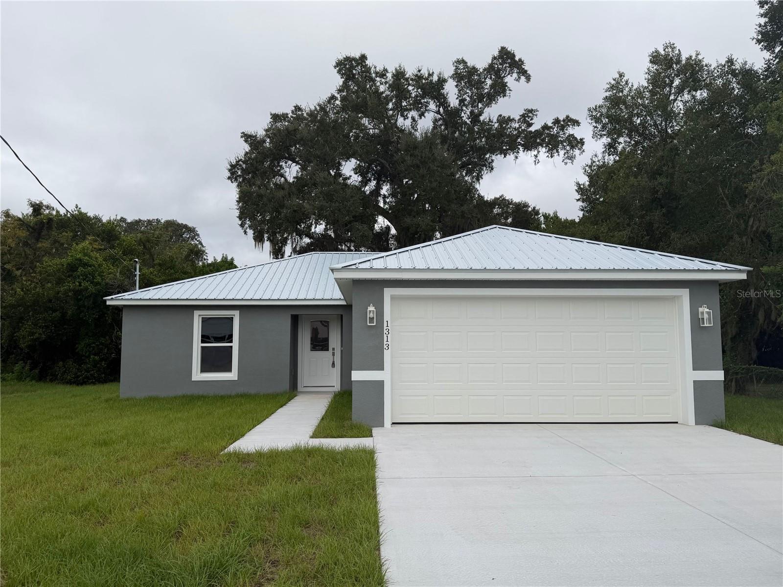 Brand new home in the heart of Winter Haven! This beautiful 3-bedroom, 2-bathroom home offers the perfect blend of style and convenience, located just minutes from dining, shopping, and entertainment. Step inside to an open-concept living space featuring modern gray walls and durable, easy-to-maintain luxury vinyl flooring. The galley-style kitchen shines with elegant granite countertops, stainless steel appliances, sleek cabinetry, and a pantry for additional storage. Additional features include a dedicated laundry closet, an attached 2-car garage, and charming French doors that open out from the great room to a spacious backyard perfect for outdoor activities. Don't miss this home; call us today!