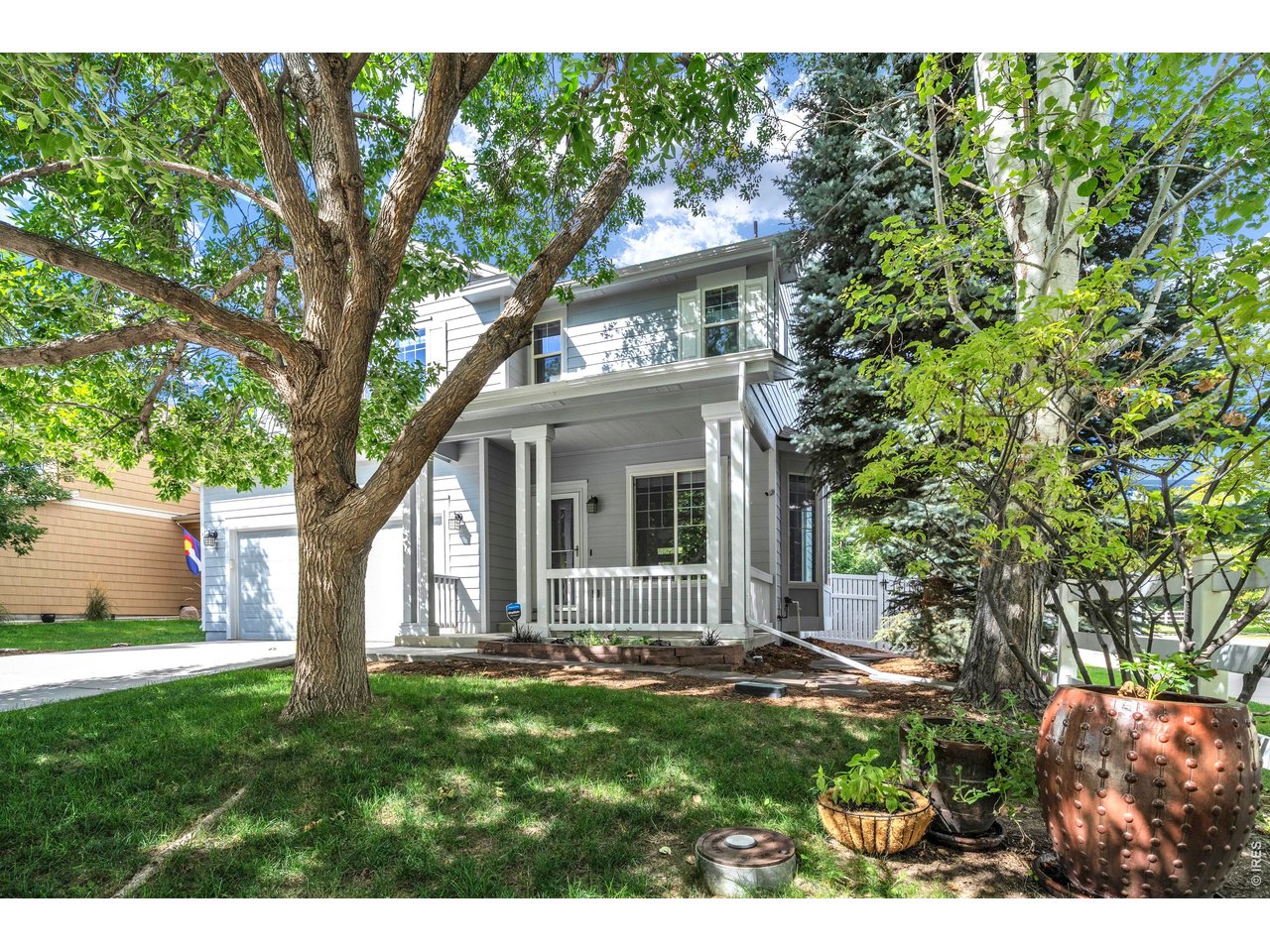 This is a gorgeous home, with so many upgrades, it feels like a new! Located in the Renaissance Neighborhood on a quiet private drive. This high quality home offers an open floor plan, main level wood floors, an updated kitchen with granite counters, glass and marble backsplash, refaced cabinets, breakfast bar, family room with gas fireplace and a separate living room. The 2nd floor has a large primary bedroom with a 5-piece bath, dual closets, 2 additional bedrooms, and a loft area that could be study, den, TV room, play area. The yard is professionally landscaped, highly functional, with a new large backyard deck. The basement is unfinished, but could be a 4th bedroom, recreation room, a workout area. Recent upgrades include, new furnace and A/C, backyard deck, exterior paint, roof (2023), hot water heater, carpet, and interior paint. A great neighborhood close to trails, open space, and close to essential shopping. Easy access to Boulder or the mountains.