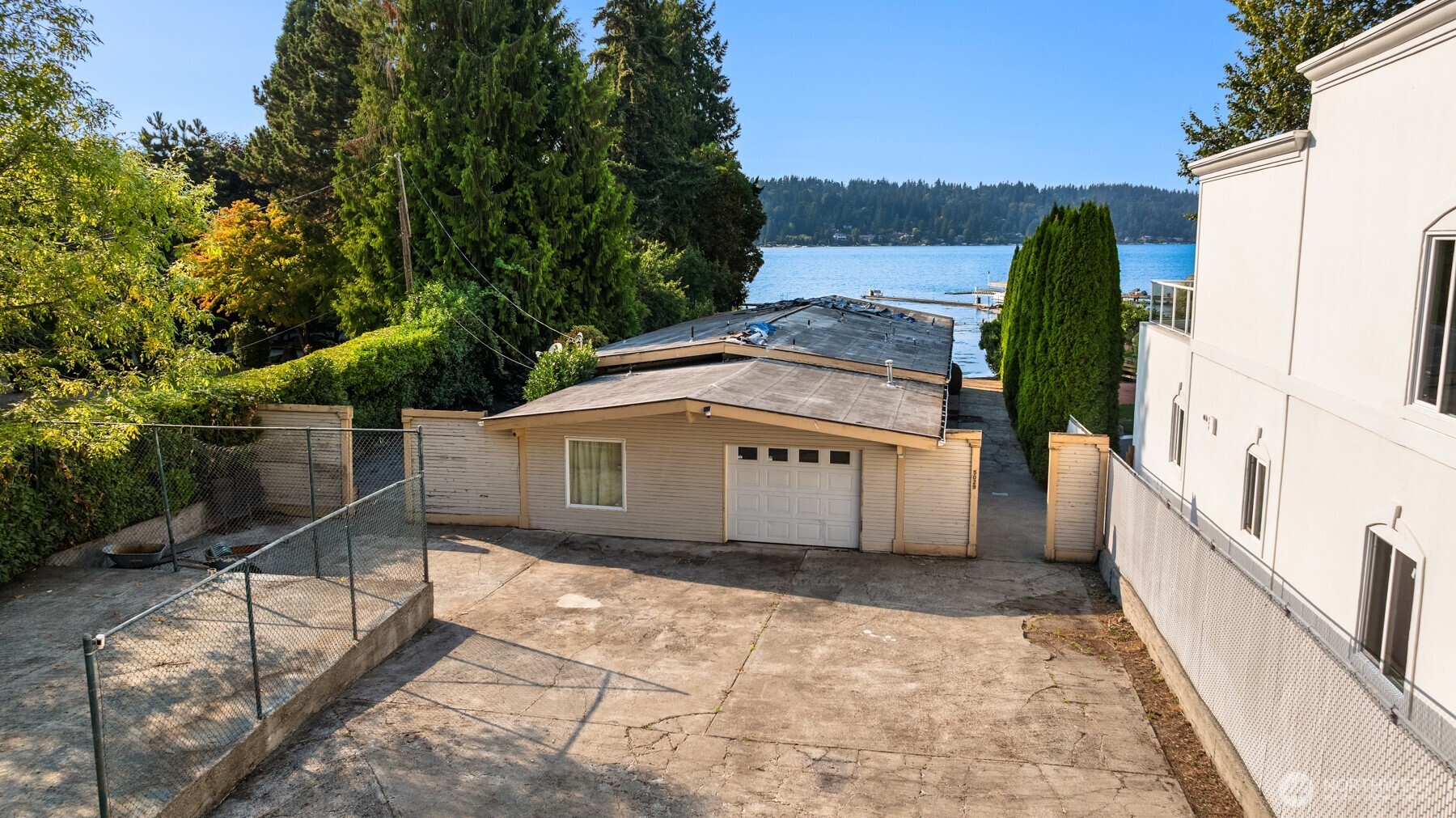 A rare opportunity to bring your vision to life along the shores of Lake Washington. Nestled in an exceptional waterfront setting, this property offers incredible potential to reimagine, renovate or create a custom home that captures the beauty of its surroundings. A private dock adds to the appeal, offering the opportunity to enjoy all that lakefront living has to offer. Imagine designing a home tailored to your lifestyle, with the lake as your backdrop and the freedom to create something uniquely your own. Whether you envision a thoughtful transformation or a fresh start, the possibilities are exciting. Set in one of the region’s most coveted waterfront locations, this is a chance to create something truly special.