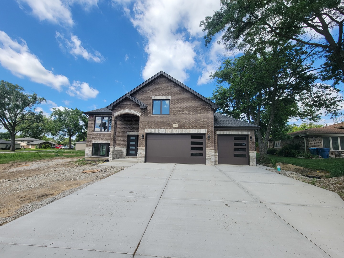 MAGNIFICENT NEW CONSTRUCTION!!, 5 bedrooms (2 master bedrooms w/large walk-in closets, 4 baths, and 3 CAR GARAGE). Exceptional quality in this luxury open, bright floor plan with 10 PLUS ft. ceilings (9ft ceilings on the lower level). The numerous oversized windows throughout this home allow for natural light and views of the outdoors. Gorgeous kitchen with quartz countertops, elegant backsplash, enormous island with built in Microwave, Stainless steel appliances. Living room with fireplace & vaulted ceilings. Large master bedroom with 14x7 walk-in closet and custom-designed master bath with walk-in shower. Fully finished 9ft ceilings basement with 2 entrances. From the moment you enter this beautiful home, you will be impressed with the high level of quality & craftsmanship. Words cannot describe. Over size 3car garage. No pictures can show this Gorgeous Home. Truly a must-see! This is your home!!