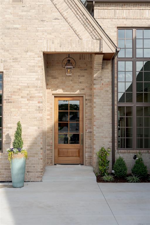 This is a new construction home, available for lease and also listed for sale MLS #1247072. This beautifully designed Parade Home in the desirable Cottage Grove addition pairs timeless architecture with warm, curated interiors. From its light-brick exterior and steeply pitched gables to the oversized divided-light windows and generous motor court, 2816 Evening Stroll Drive makes an immediate impression. Inside, natural light fills the home, highlighting wide-plank wood floors, tailored wall paneling, exposed wood beams and a sophisticated palette that feels elevated and inviting. The main level is designed for everyday living and entertaining, with an open living and dining area flowing into a beautifully appointed kitchen featuring a large island, walk-in pantry with beverage refrigerator. Double sliders open to a covered patio and balcony, creating an easy connection between indoor and outdoor living. The main level also includes a dedicated study, mudroom, powder bath and serene primary suite. The airy primary bathroom connects to a generously sized closet and flows into the laundry room, creating a beautifully functional private retreat. The lower level offers flexibility with three additional bedrooms, two full bathrooms, a second powder bath and a spacious bonus room that can function as a game room, media space or additional living area. An unfinished storage and mechanical room provides valuable storage, while another covered patio opens to the fully fenced backyard. The location is just minutes from the growing Covell and I-35 corridor, residents enjoy convenient access to Crest Fresh Market, Starbucks, Braum’s and an expanding collection of dining and retail amenities, with future development including Whole Foods, Texas Roadhouse and more. This is a new construction home, available for lease and also listed for sale MLS #1247072.