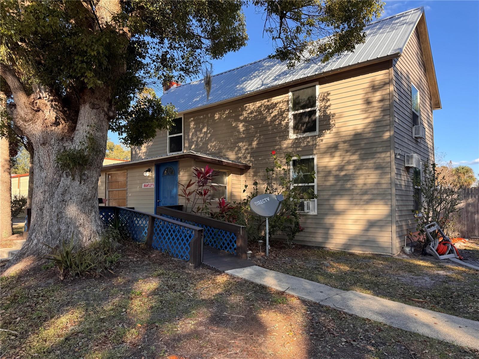 Charming Historic Home in Heart of Downtown Umatilla! Welcome to this beautiful Lake County residence just steps from downtown Umatilla’s shops, dining, boutique coffee spots, and schools! This classic 2-story home offers modern comfort while preserving timeless character. 3 Bedrooms | 2 Full Baths. Metal Roof (2019) & Mostly New Windows. Oversized Lot with Detached Garage completely fenced in. Private Pool & Jacuzzi. Step inside to inviting living spaces with luxury vinyl plank flooring on the main level and a cozy living room featuring a gas fireplace. The open concept kitchen boasts high vaulted ceilings, stainless steel appliances, and a gas stove, perfect for everyday living and entertaining. Upstairs you’ll find two generous bedrooms and a full bath, offering comfortable private living quarters. Outside, enjoy an expansive, fully fenced backyard oasis with ample room for parking a boat or RV, a detached garage, and a private pool and jacuzzi — ideal for relaxing and entertaining. Enjoy historic charm, modern updates, and an unbeatable walkable location in one of Umatilla’s most desirable neighborhoods!