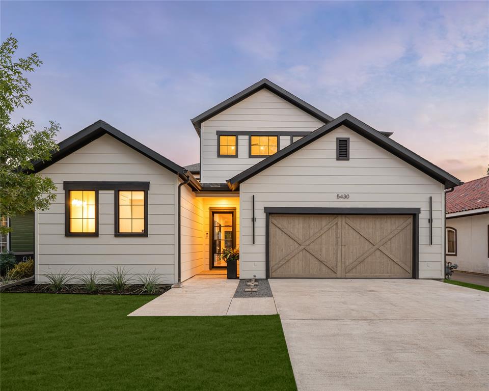 A striking designer transformation in the heart of coveted Vickery Place, this exceptional turnkey residence has been completely reimagined with a sophisticated aesthetic, elevated finishes, and an emphasis on seamless indoor-outdoor living. Every space feels intentional and polished. Beyond the impressive exterior and front-entry two-car garage, the interiors unfold into an expansive, light-filled living environment designed for effortless entertaining. Dramatic great room is anchored by a floor-to-ceiling stone fireplace, while a custom entertaining bar with wine refrigerator adds a refined hospitality element. Walls of sliding glass doors blur the distinction between indoors and out, opening to a private turfed side courtyard and creating an incredible flow for gatherings large or intimate. At the heart of the home, the showpiece kitchen combines clean-lined design with exceptional functionality. An oversized statement island, designer pendant lighting, built-in refrigerator, gas cooktop, and pot filler create a beautifully curated culinary space. The sun-filled dining room enjoys picturesque views of the backyard, while a thoughtfully designed mud bench provides stylish everyday storage. The private primary suite is a retreat unto itself, generously proportioned and complemented by a spectacular spa-inspired bath with a serene, high-design aesthetic worthy of a luxury resort. Spacious secondary bedrooms provide beautifully appointed accommodations for family and guests with flexibility for a private office or additional lifestyle space. Outside, the home transforms into a private resort. An expansive covered patio creates a true outdoor living room, complete with a built-in kitchen, grill, and sink overlooking the sparkling pool and spa. Multiple entertaining spaces, manicured surroundings, and seamless connections to the interior make this backyard an extraordinary extension of the home. Perfectly positioned in one of Dallas' most desirable neighborhoods!