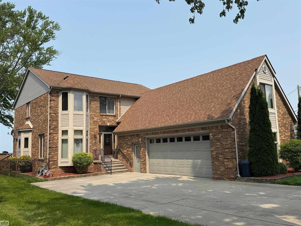 Wake up to breathtaking water views and lakefront living on beautiful Lake St Clair. This spacious custom-built brick colonial offering nearly 3,500 sq ft of living space features 4 bedrooms, including spacious primary en-suite with private balcony, 3 full baths, and a 37'x 12' bonus room above the garage ideal for 4th bedroom, guest suite or rec room. The home offers an entertainer's kitchen with LaFata cabinetry, formal dining, private office, four-season sunroom, and second floor laundry adds ultimate convenience. Additional highlights include central vac, whole house generator, heated crawl space, attached 2 1/2 garage plus 1-car detached, fully fenced yard and private boat slip with electricity. Bring your boat and start living the lakefront lifestyle.