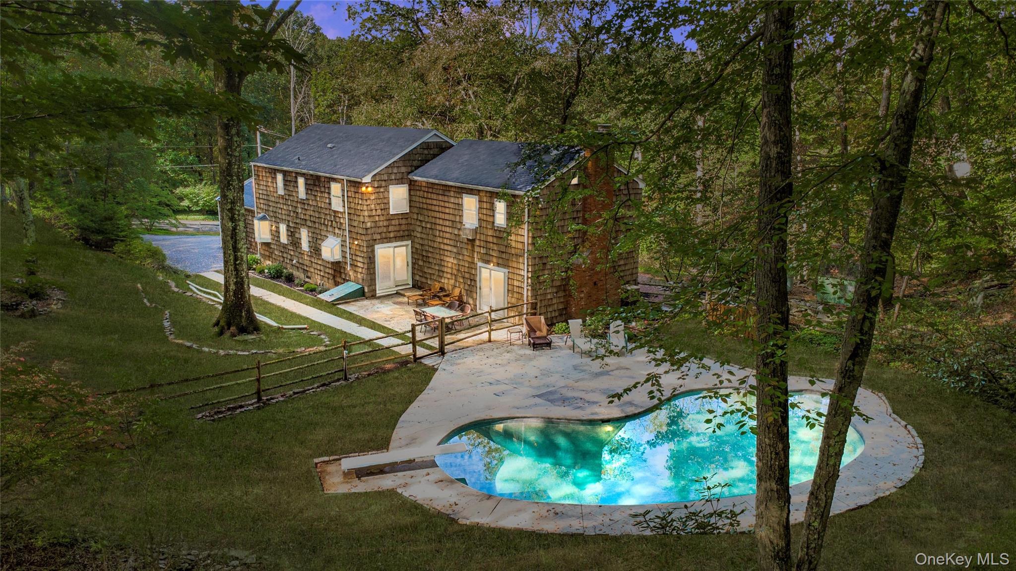 Discover this beautiful Pound Ridge gem—perfect as a full-time residence or a great weekend retreat.
Enjoy the best of summer living by the pool, whether you’re relaxing in the sun or entertaining friends and family.
Inside, the updated kitchen boasts upgraded appliances—refrigerator, oven, dishwasher, and microwave—making it truly move-in ready. The flexible layout is designed for both comfort and privacy: four bedrooms and two baths are thoughtfully situated upstairs on one side of the home, while an additional two bedrooms and one bath are located off the kitchen and upstairs on the opposite side—ideal for guests, extended family, or a private office suite.
Practical updates include a new above-ground oil tank and a new boiler, adding peace of mind. In addition, it has also been freshly painted, and the hardwood floors refinished.
Perfectly positioned, this home is within walking distance to the Pound Ridge Tennis Club and just a 7-minute drive to the shops, dining, and charm of Scott’s Corners.
Whether you’re looking for a serene weekend getaway or a year-round haven, this Pound Ridge home offers the perfect blend of comfort, convenience, and lifestyle.