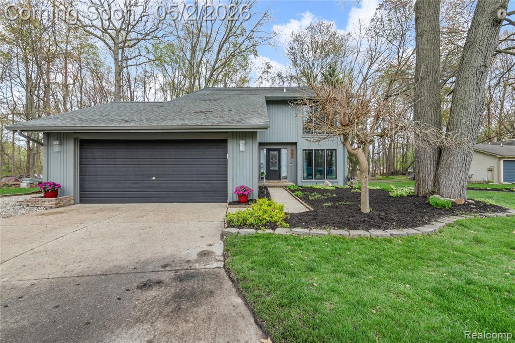 Spectacular home in desirable Cedar Oaks subdivision, nestled in a serene cul-de-sac. This home features three bedrooms. three full remodeled bathrooms, an oversized 2.5 car attached garage, and a beautiful remodeled kitchen that opens to a large deck through dual sliding glass doors,  perfect for effortless indoor-outdoor living, and entertaining, shining with an abundance of natural sunlight.  A second set of sliding glass door off living room to the den leads to the same deck, where the adjoining wet bar creates an ideal space for entertaining, grilling, and family gatherings.  Enjoy the ambience of the living room fireplace or step outside to the backyard fire pit and unwind to the warm, crackling glow of a toasty evening fire.  The second level primary bedroom is spacious from entry to remodeled bath, offering a walk-in closet, and private balcony with tranquility views.  Two addtional generous bedrooms, remodeled full bath, and the convenience of a second floor laundry with fan, exhaust completes the upper level.  The partically finished lower level basement offers an open canvas ready for your ideas, dreams to expand living, recreation, or hobby space.  From the curb appeal to the final steps into the basement, this home reflects thoughtful updates and a cohesive remodel from the moment you walk through the door to the moment you step out onto the large deck.  Mechanical updates and improvements continue throughout-contact your realtor for details. BATVAI.  ADAMA.