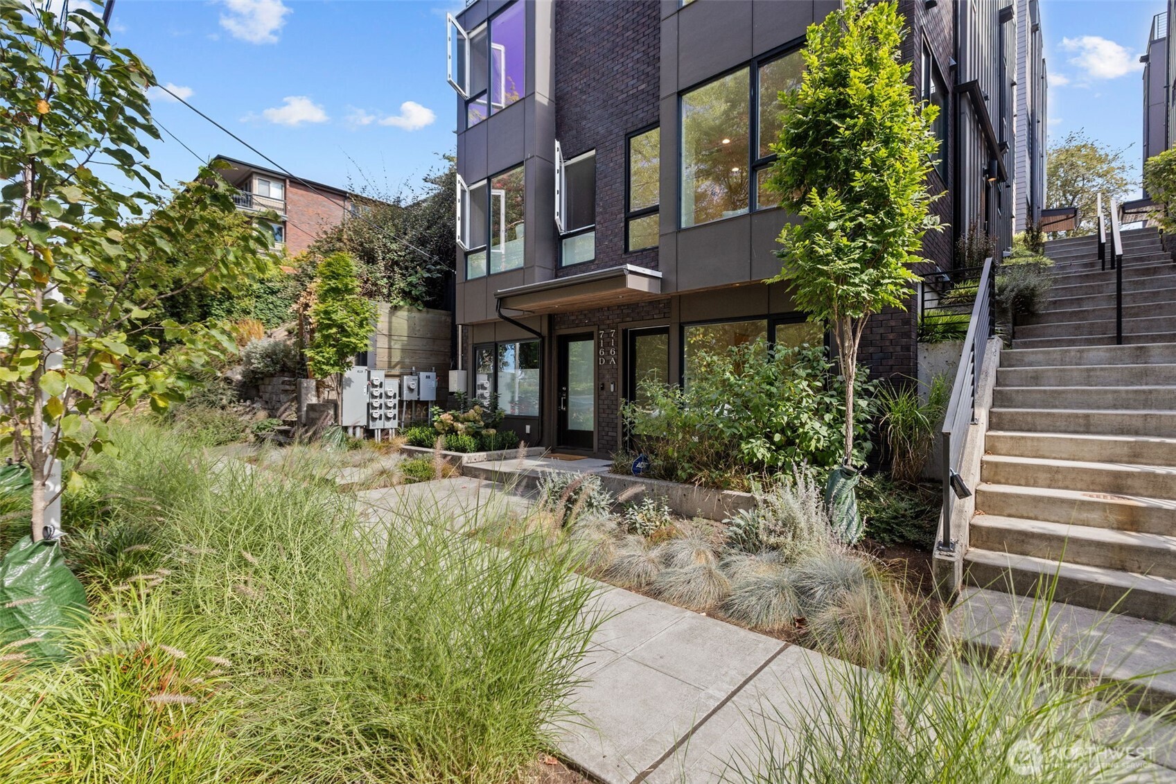 Welcome home! Enjoy modern living in this beautifully designed townhouse tucked along a peaceful residential street. Inside, abundant natural light pours through oversized windows and complements the contemporary finishes throughout. The stylish kitchen features quartz countertops and high-end appliances, while the top-level primary suite offers a generous closet with custom built-ins, a walk-in shower, and a convenient seated vanity. Mini-split heating and cooling provide efficient year-round comfort. The rooftop deck is a standout feature, offering city views and an ideal setting for morning coffee, evening sunsets, or entertaining guests. With a Walk Score of 90, you'll have easy access to neighborhood restaurants, coffee shops, parks, shopping, and transit. A wonderful opportunity to enjoy the best of Capitol Hill right outside your door.