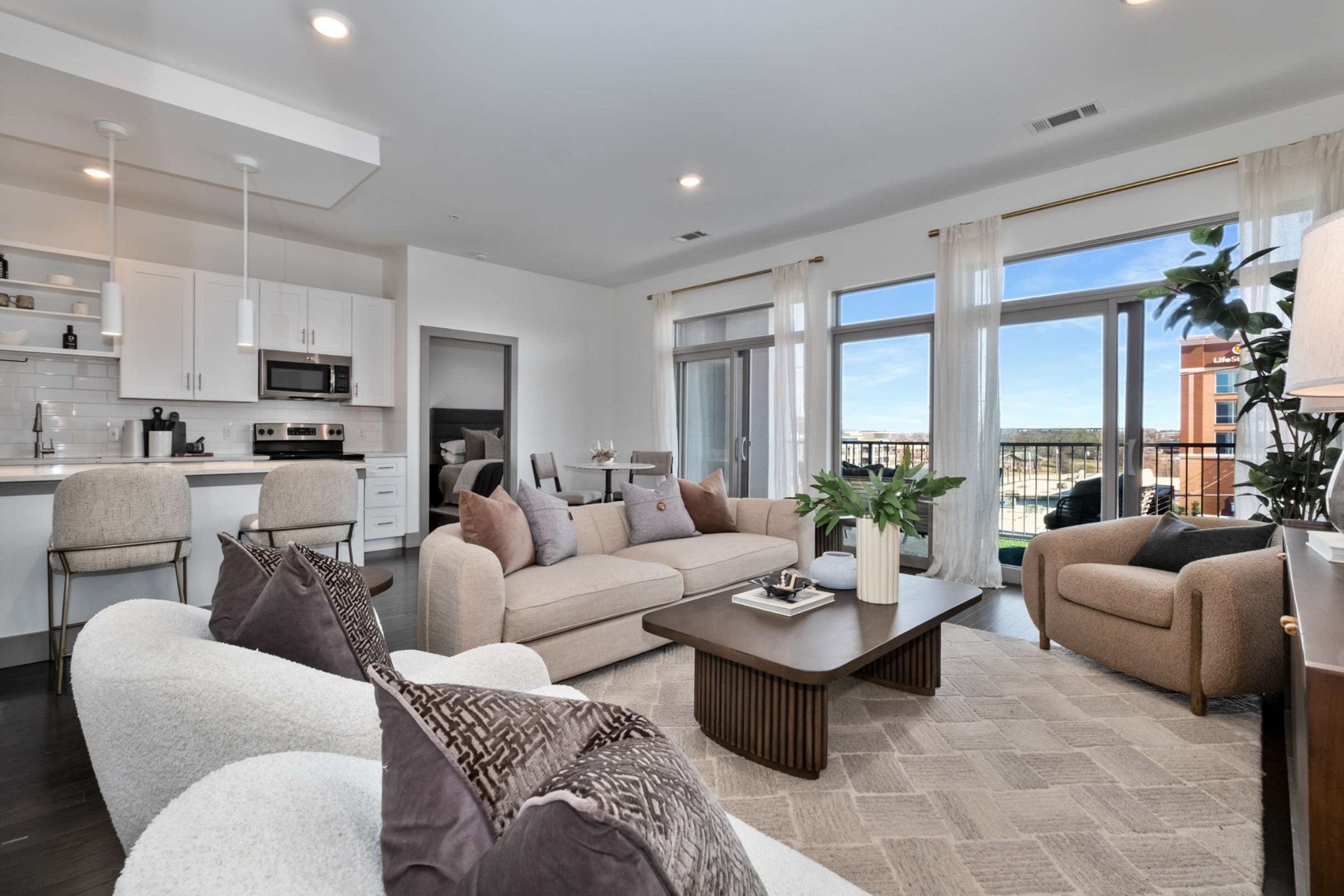 Perfectly situated between 12 South and Wedgewood Houston, this condo is just minutes to downtown Nashville, The Gulch, and Vanderbilt and Belmont.  Easily walkable to shopping and restaurants (Urban Juicer, M.L Rose Craft Beer & Burgers, Maple Street Biscuit Company to name just a few), this stunning unit has been meticulously maintained and is flooded with light. Offering secure building access and two designated parking spaces, this 4th Floor corner unit features an open and airy floor plan with a designated foyer entrance hall, stunning and substantial kitchen island, pristine stainless steel appliances, and expansive terrace with ample seating. The Primary suite features a large pass through closet, tiled bath, dual vanities, and oversized walk-in shower. Secondary bedroom with generous walk-in closet and private second bath entrance. Laundry closet with washer/dryer.  This is easy Nashville living in the heart of it all!