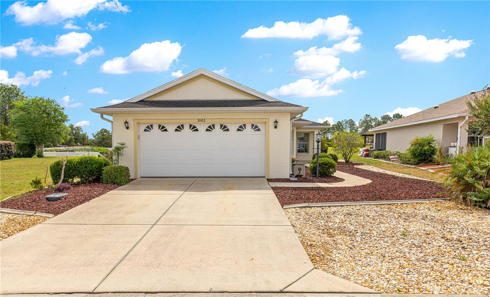 Popular Sheffield Model – Private Green Space Views + Whole-Home Generator!Experience the comfort, security, and easy living you’ve been looking for in this beautifully maintained Sheffield Model, ideally located in the premier 55+ gated golf community of On Top of the World in SW Ocala. From the moment you arrive, the pride of ownership is evident, and the zero-scaped yard means lower water bills and minimal upkeep—perfect for a lock-and-leave lifestyle or simply enjoying more free time. Step inside and enjoy immediate green space views straight through the home, creating a peaceful, private backdrop you’ll appreciate every day. The open-concept kitchen and great room make entertaining easy, while solar tubes throughout fill the home with natural light. Designed for comfort & convenience: 2 bedrooms with split floor plan for privacy, Flex room with French doors (ideal for an office, hobby room or den). Spacious primary suite tucked in the back with 2 closets (including a walk-in), En suite bath with step-in shower and comfort-height toilet for ease of use, private guest area with nearby bath—perfect for visiting family and friends. Kitchen Highlights: ample cabinets and counter space, Natural gas stove and appliances, deep stainless farmhouse sink, NEW refrigerator, eat-in kitchen space + pantry. Enjoy Florida living year-round in the finished Florida room or step outside to your fenced backyard with paver patio—perfect for relaxing, entertaining, or giving your pet safe place to roam—all while enjoying serene green space views with no rear neighbors. Major features: 2019 Whole-house Cummins generator for peace of mind during outages, 2014 Trane HVAC system (2016 compressor), Culligan whole-house water filtration & softener system, SOLAR attic fan, NO popcorn ceilings, indoor laundry room with extra storage space, utility sink & freezer (included!). Spacious 2-car garage with ample storage. This home checks all the boxes for comfort, efficiency, and low-maintenance living, all within a vibrant, amenity-rich, golf cart-friendly community. Enjoy the lifestyle you’ve earned—with space, privacy, and peace of mind built right in. The monthly HOA fee includes basic Spectrum cable, roof repair, exterior painting every seven years, exterior maintenance and insurance, landscaping, trash & recycling, 24/7 monitored gates and what seems like endless amenities; four pools (3 outside & 1 inside), two state of the art fitness centers, pickleball (uncovered & covered), billiards, archery range, corn hole, bocce ball, tennis, shuffleboard, horse shoes, remote control flying field and race cars, 175+ clubs, woodworking shop (extra fee), library, and much, much more! A golf cart community with access to several shopping centers. Centrally located 20 minutes from the World Equestrian Center, easy drive to 4 cruise ports and/or airports, and within a close proximity to entertainment complexes in Orlando. This home is located on leased land, 99-year land lease from year the home was constructed. Community standards require 20% down with all mortgages.