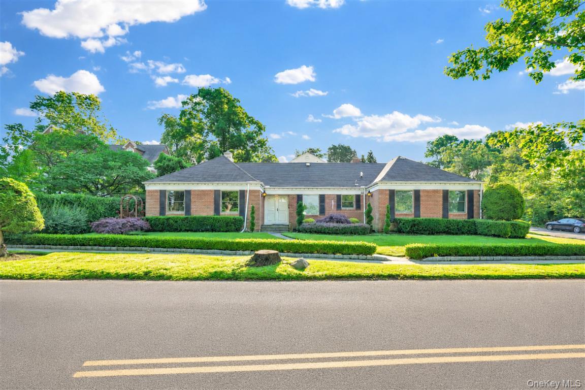 Magnificent sprawling ranch located in the prestigious waterfront community of Douglaston Manor, offering rare water views and breathtaking sunsets throughout the year. One of the few nonconforming properties in the neighborhood, with no restrictions to expand this property to a 5/6 bedroom home, this exceptional residence seamlessly blends luxury, comfort, and the convenience of one-level living. The main floor features a spacious living room, formal dining room, family room with a new wood-burning fireplace insert, three bedrooms with an abundance of closet space, and 1.5 beautifully updated bathrooms. The stunning chef’s eat-in kitchen, completely renovated in 2020, is appointed with Corian countertops, premium appliances, and elegant tile flooring.The home underwent a complete gut renovation in 2020, including all-new electrical wiring, plumbing, walls, ceilings, and refinished hardwood floors throughout. Additional upgrades include four separate heating and cooling zones, a new 5-ton central air conditioning system, four Mitsubishi split units, a new 75-gallon hot water heater, spray foam insulation throughout, Anderson windows installed in 2022, a central vacuum system, a new alarm system, and 4K security cameras surrounding the property. All built-ins and installed electronics will remain. A new septic tank was installed in 2024.The fully finished basement features approximately 8-foot ceilings and offers exceptional entertaining space with a spacious entertainment area showcasing beautiful porcelain tile flooring, a custom bar, gym, laundry room, and full bathroom. A finished second-floor bonus area, completed in 2020 with 8-foot ceilings and custom cabinetry, provides tremendous flexibility and can easily accommodate two to three additional bedrooms, a home office, playroom, or recreation area.The exterior is equally impressive, showcasing professionally designed landscaping, an in-ground sprinkler system, new sidewalks, and a new driveway. The fully enclosed backyard serves as a private oasis with beautiful pavers, a Jacuzzi hot tub, and a full canvas tent enclosure, perfect for year-round enjoyment and entertaining. A two-car garage with an insulated automatic garage door completes this remarkable offering. Situated on an oversized 82.17' x 100' lot with a building size of approximately 69.5' x 44', this extraordinary property also benefits from the Douglaston Manor Association, with an annual fee of just $900 providing private security, shoreline parking privileges, and access to boat docking facilities. Residents can also enjoy membership opportunities at the renowned Douglaston Club, featuring a pool, tennis courts, dining, and year-round social events. This is a rare opportunity to own a truly exceptional home in one of Queens' most coveted waterfront communities