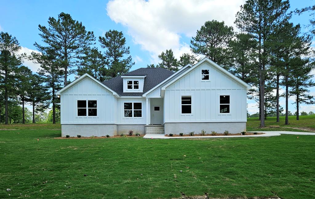 New construction homes featuring custom finishes in a great Cairo, Georgia subdivision. Conveniently located near Thomasville, Bainbridge, and Tallahassee. Three homes sit on 3-acre tracks, with two additional homes on a 1.5-acre tract. Covered patios and thoughtfully designed layouts offer modern living with plenty of space. Primary  bathroom includes a large tile shower and double vanities. Luxury Vinyl Plank (LVP) flooring runs throughout the home for durability and style. The kitchen showcases an abundance of cabinets, a kitchen bar, and granite countertops. Outdoor spaces include covered patios for comfortable outdoor living.