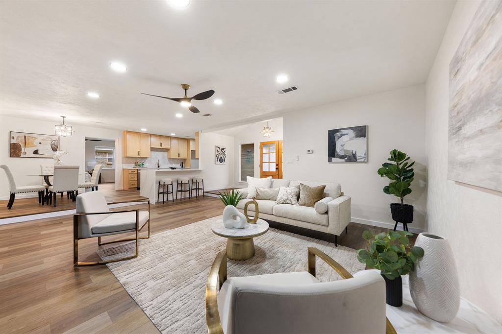 STUNNING fully renovated 3-bedroom, 2-bath, 2,065 sq ft home in a highly desirable North Bedford location! From the layout to the finishes, this open-concept, split-bedroom home has been upgraded in every way. The complete interior and exterior remodel includes a new roof, new windows, custom cabinetry throughout, LVP flooring, carpet, fresh interior and exterior paint, quartz countertops, LED recessed lighting, matte black and gold fixtures, and more. The chef-quality kitchen features waterfall island, custom natural wood cabinetry with soft-close hinges, quartz countertops, and stainless steel appliances. The spacious primary bedroom includes two walk-in closets and recessed lighting. The spa-worthy ensuite bathroom showcases dual vanities, custom cabinetry, quartz countertops, and a spa-inspired walk-in shower suite with a free-standing tub, multiple shower heads, wands, and a rain head. Fully renovated guest bath add to the home’s appeal. The outdoor space includes mature trees and a large backyard ideal for relaxing or entertaining. Located minutes from parks, shopping, dining, and major roadways. Award-winning HEB ISD. Come see YOUR new home today!
